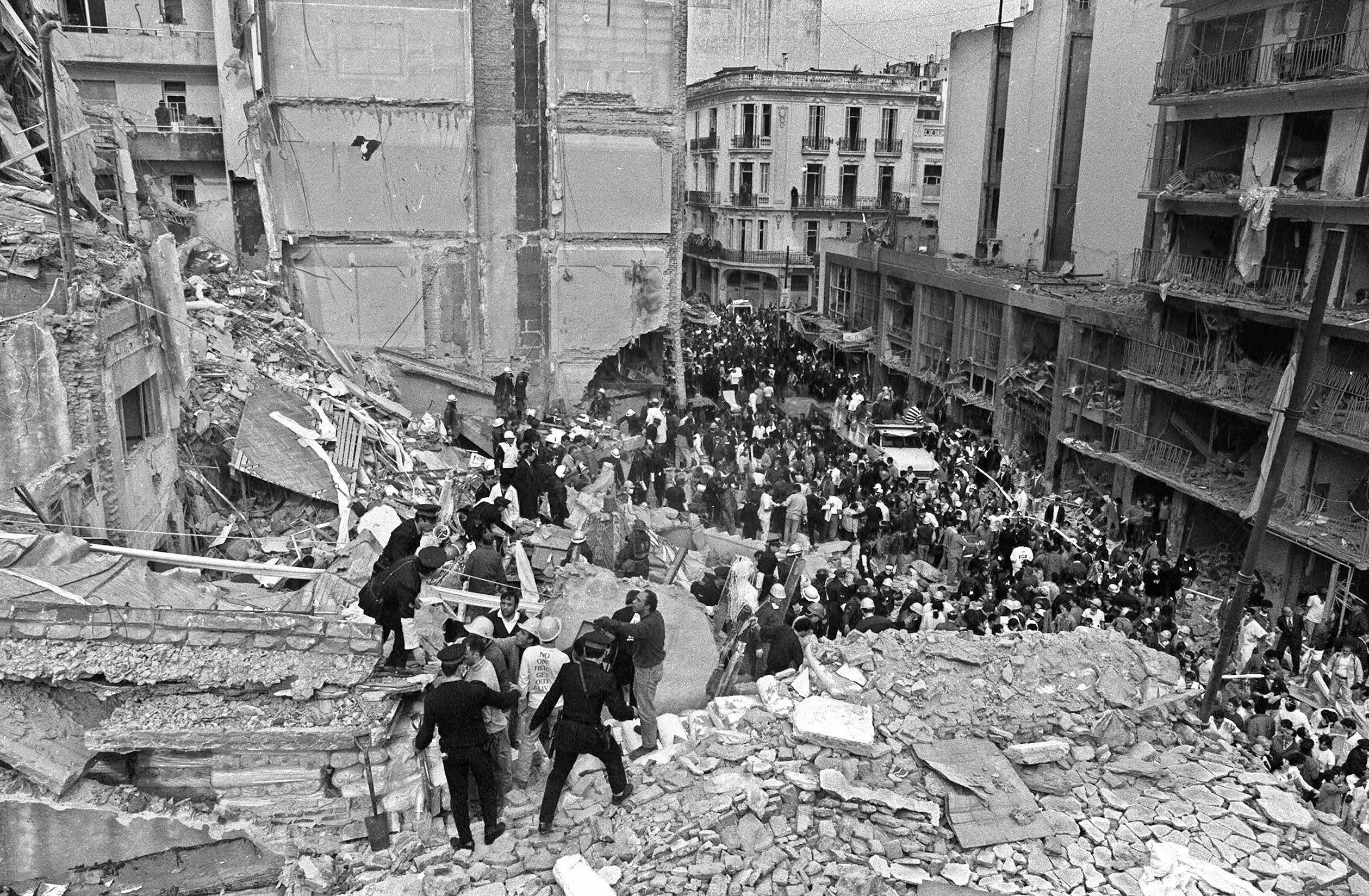 (FILE) Firemen and policemen search for