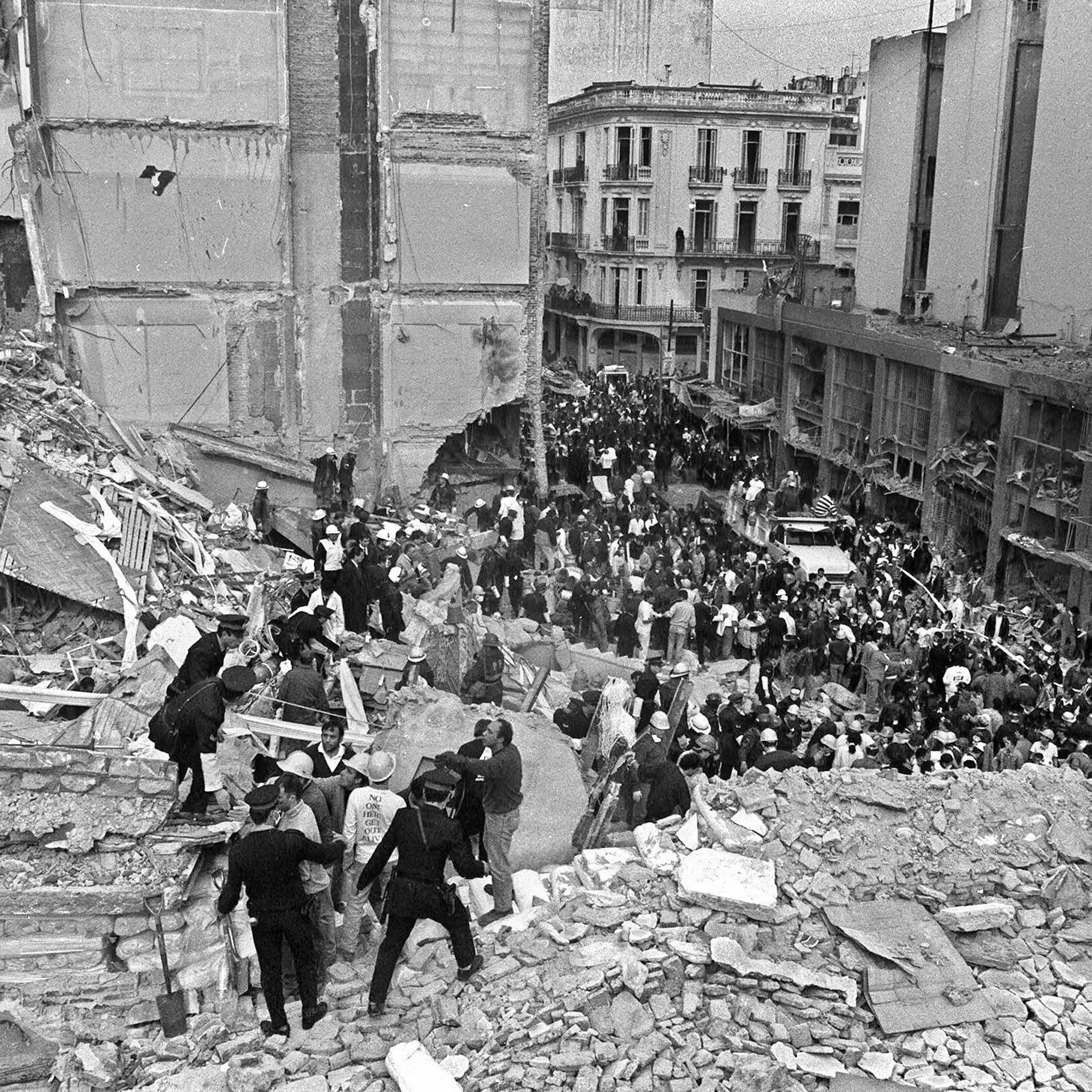 (FILE) Firemen and policemen search for