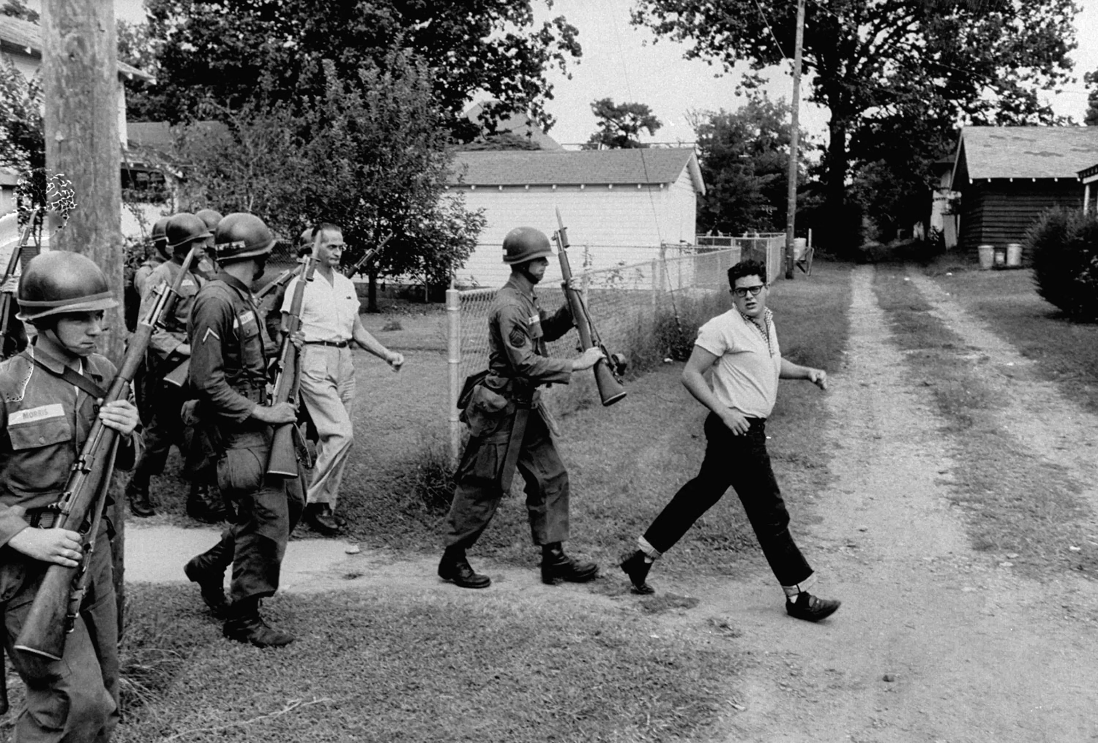 Segregationists rousted from an anti-integration protest, Little Rock, Arkansas, 1957.