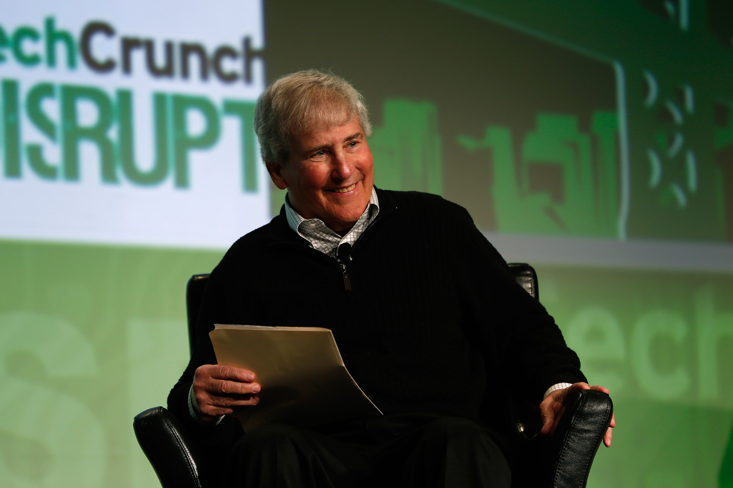 Bill Campbell, chairman of the board and former chief executive of Intuit Inc., smiles as he moderates a fireside chat with Ben Horowitz of Andreessen Horowitz during day one of TechCrunch Disrupt SF 2012 event at the San Francisco Design Center Concours