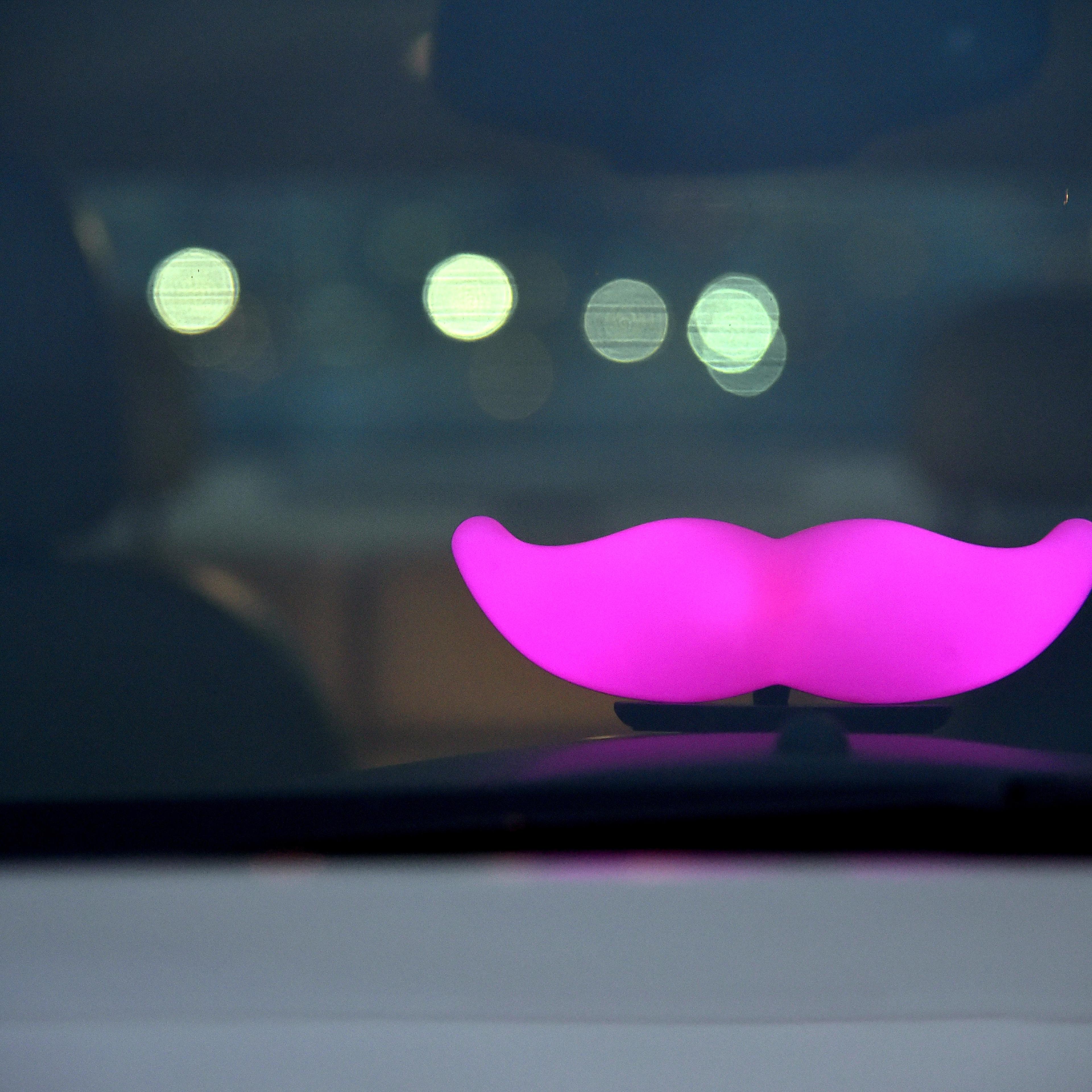 The Glowstache is seen in a Lyft driver's car in San Francisco, Calif. on Feb. 3, 2016.