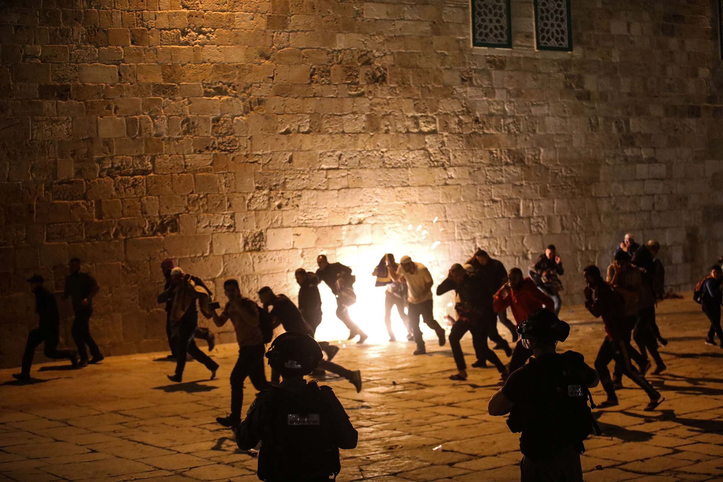 Israeli police use stun grenades and plastic bullets on Muslim worshippers in Haram al-Sharif at the site of the Al-Aqsa Mosque in East Jerusalem on May 7, 2021.