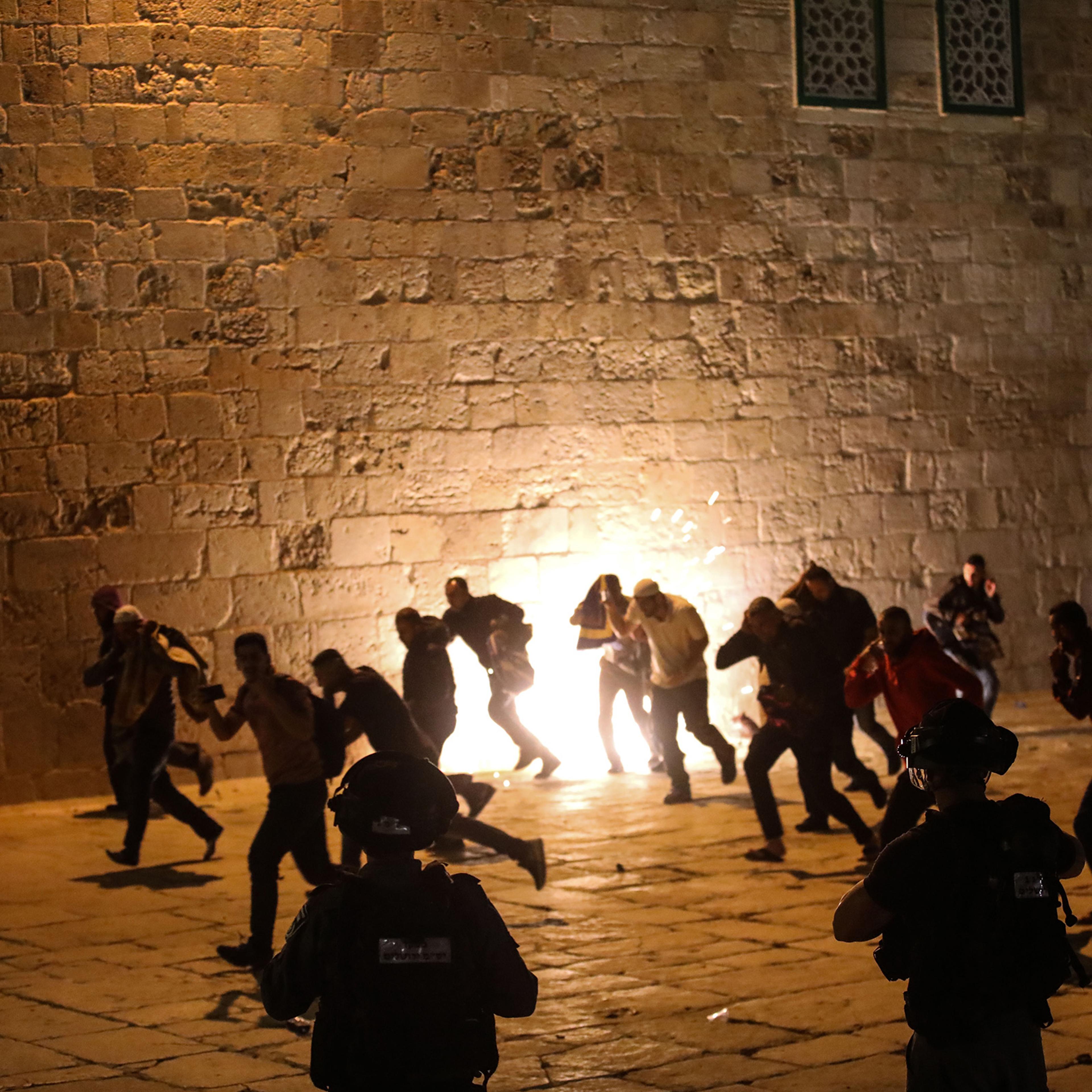 Israeli police use stun grenades and plastic bullets on Muslim worshippers in Haram al-Sharif at the site of the Al-Aqsa Mosque in East Jerusalem on May 7, 2021.