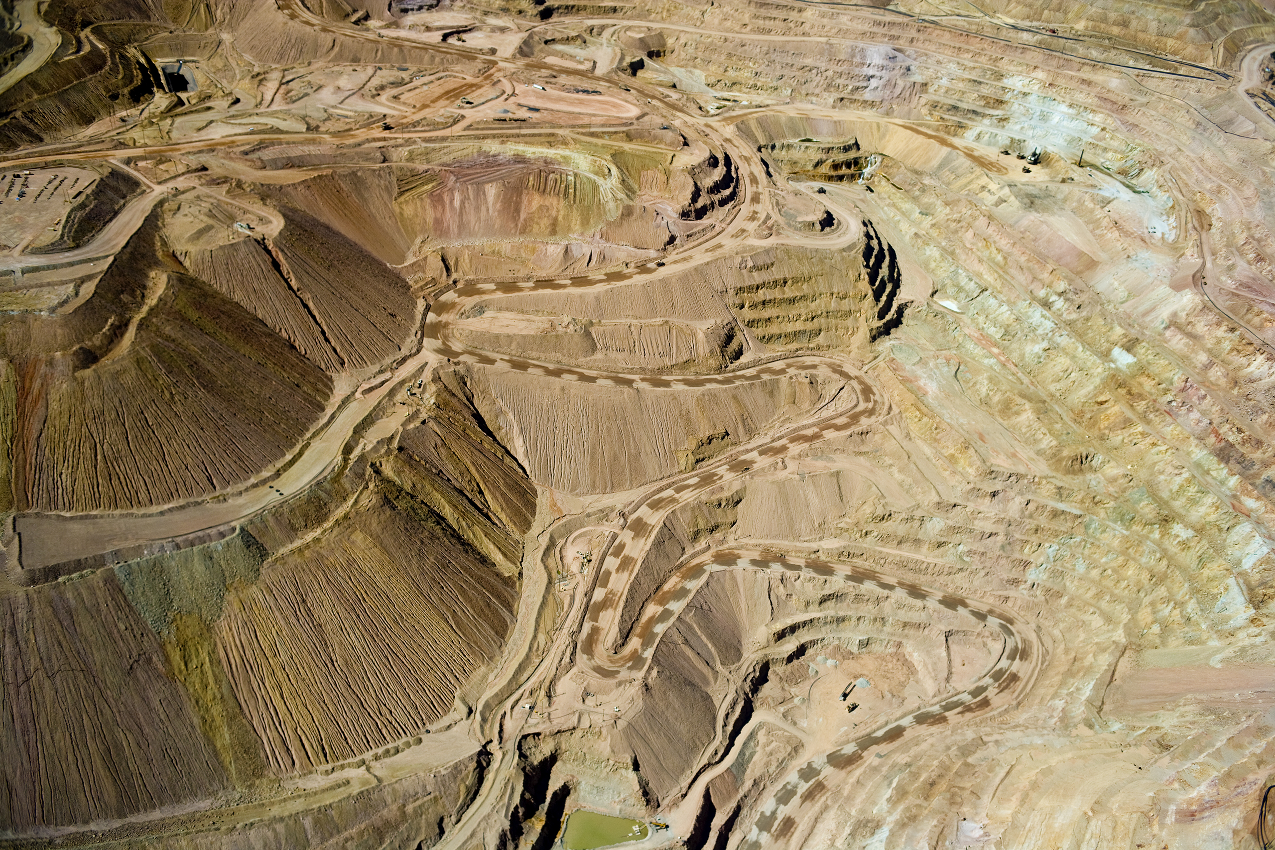 Silver City, New MexicoAt this mine, dilute sulfuric acid is percolated through enormous heaps of oxidized, low-grade ore (well under one per cent copper). The acid dissolves the copper and the resulting leachate is collected at the bottom of the heaps. 