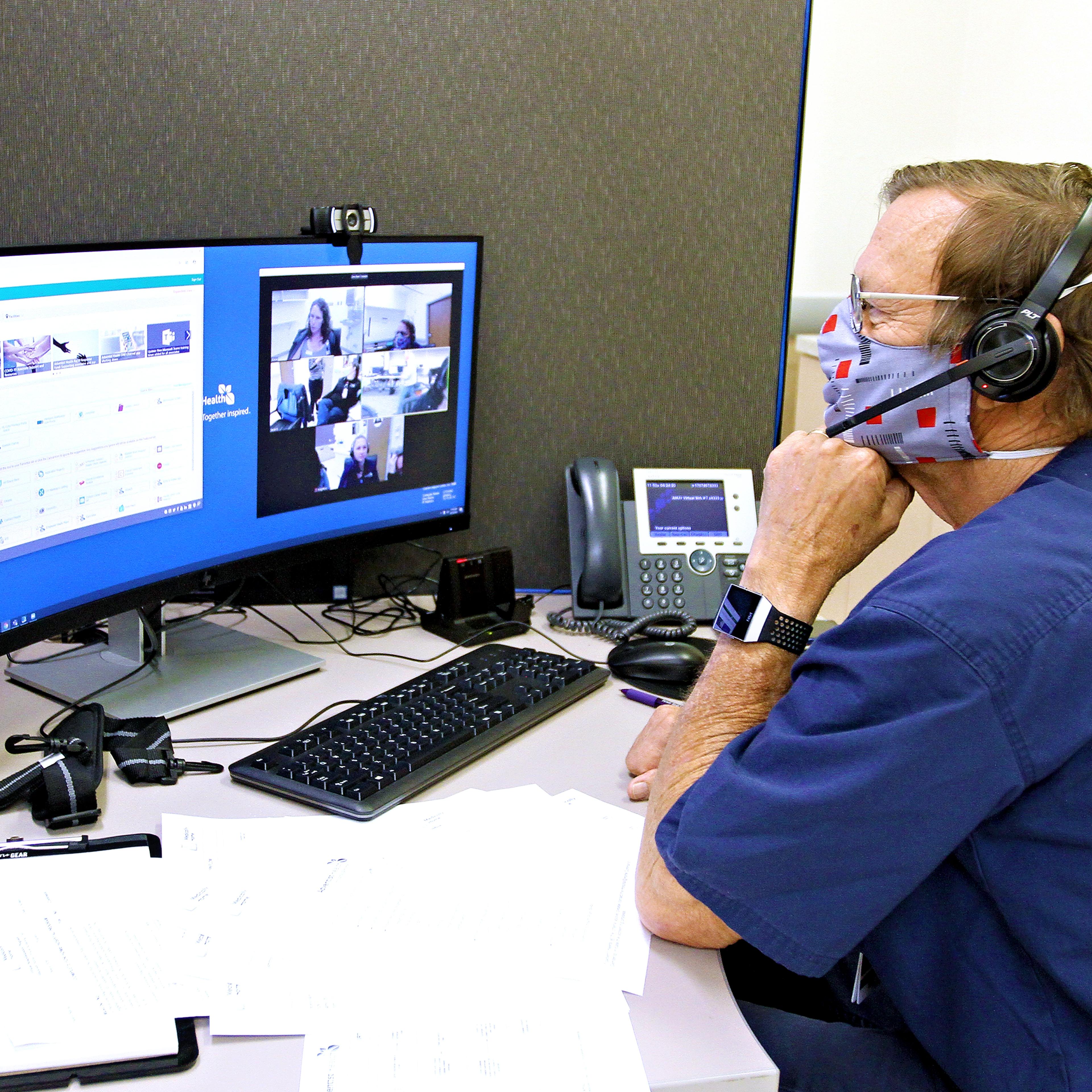 A doctor in Adventist Health's command center for its hospital-at-home program.