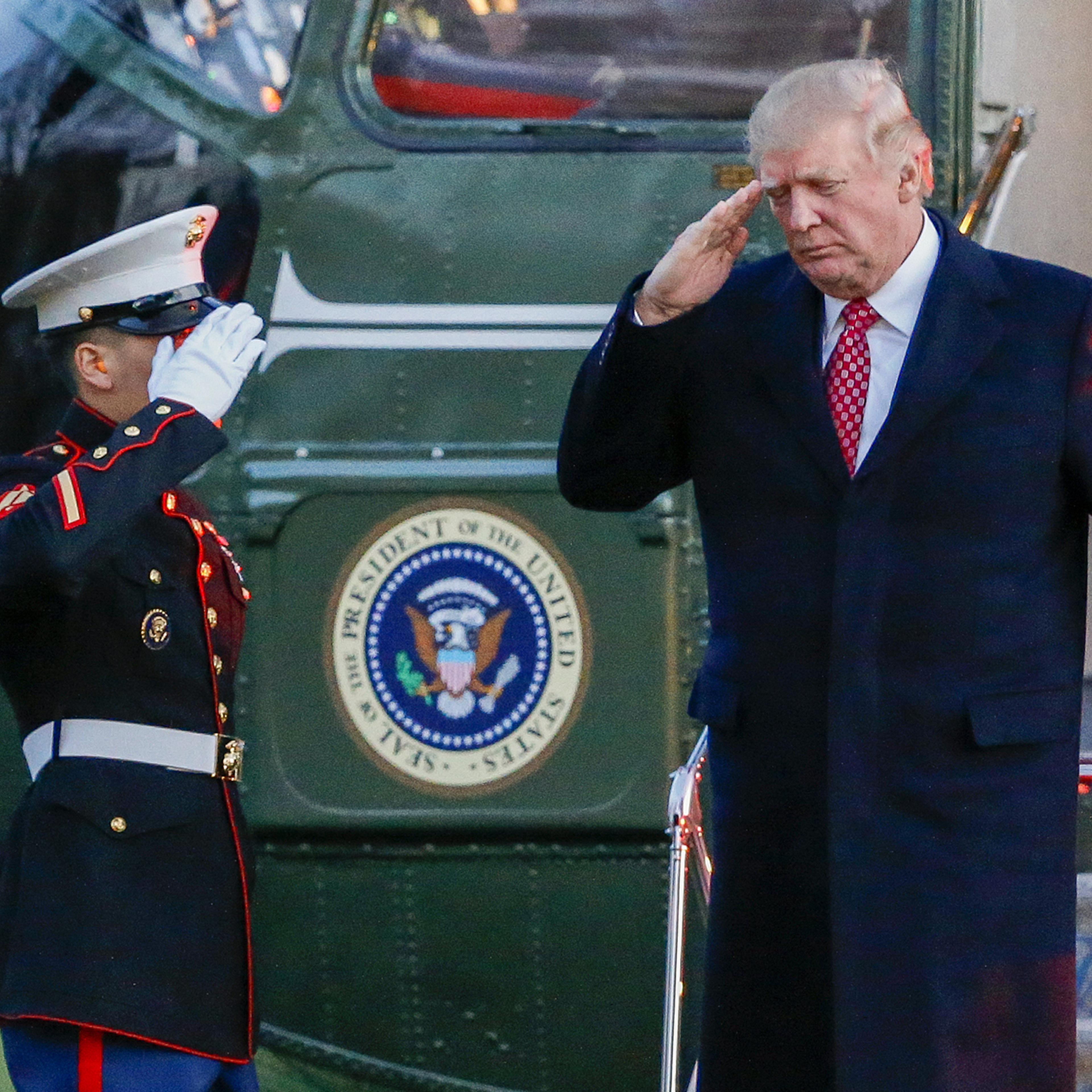 Donald Trump salutes as he disembarks Marine One on the South Lawn of the White House in Washington, D.C., on March 5, 2017.