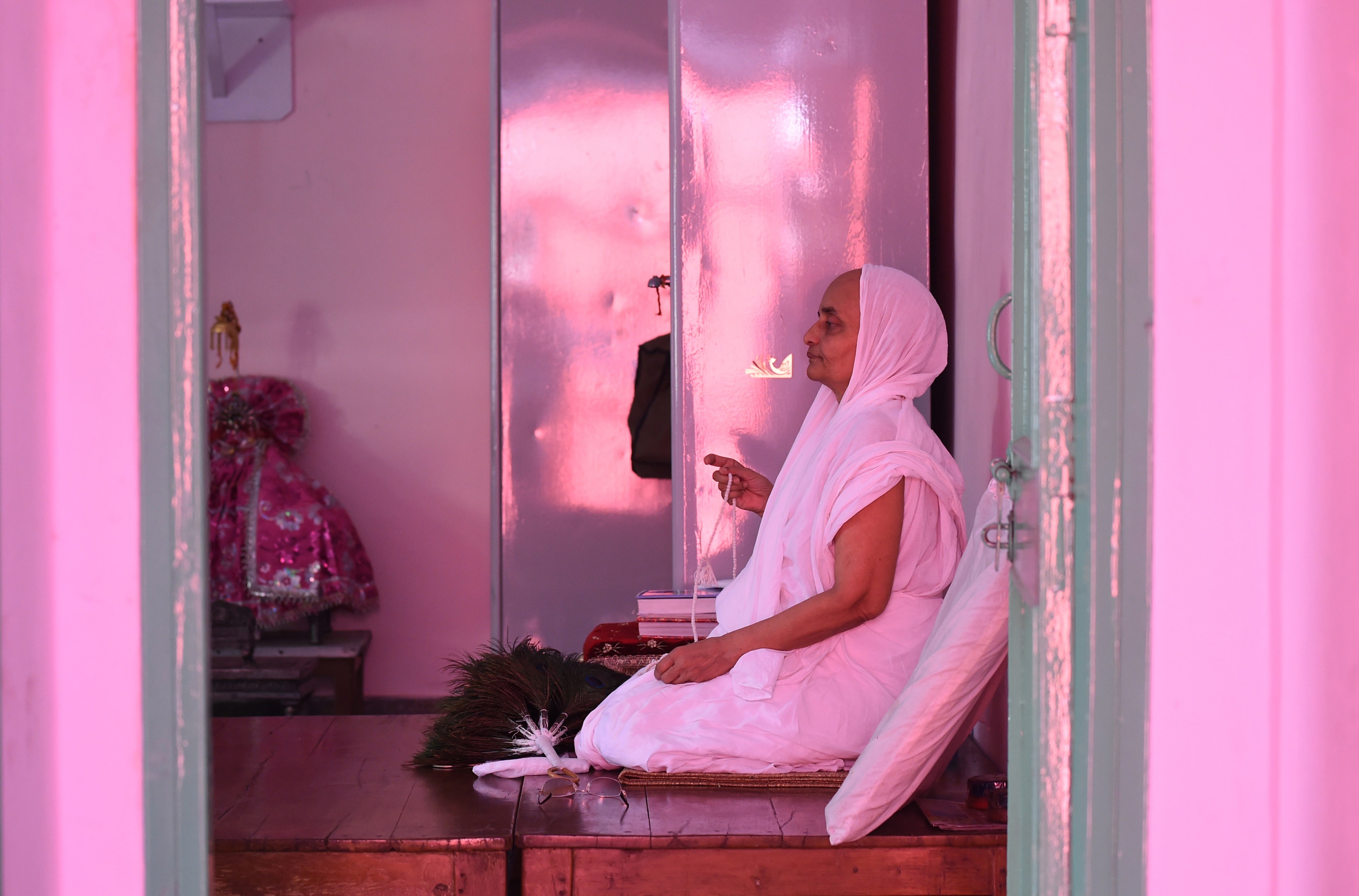 A Jain Sadhu (Jain Nun) prays in a room at the Jain Temple in the old quarters of New Delhi on August 31, 2015.