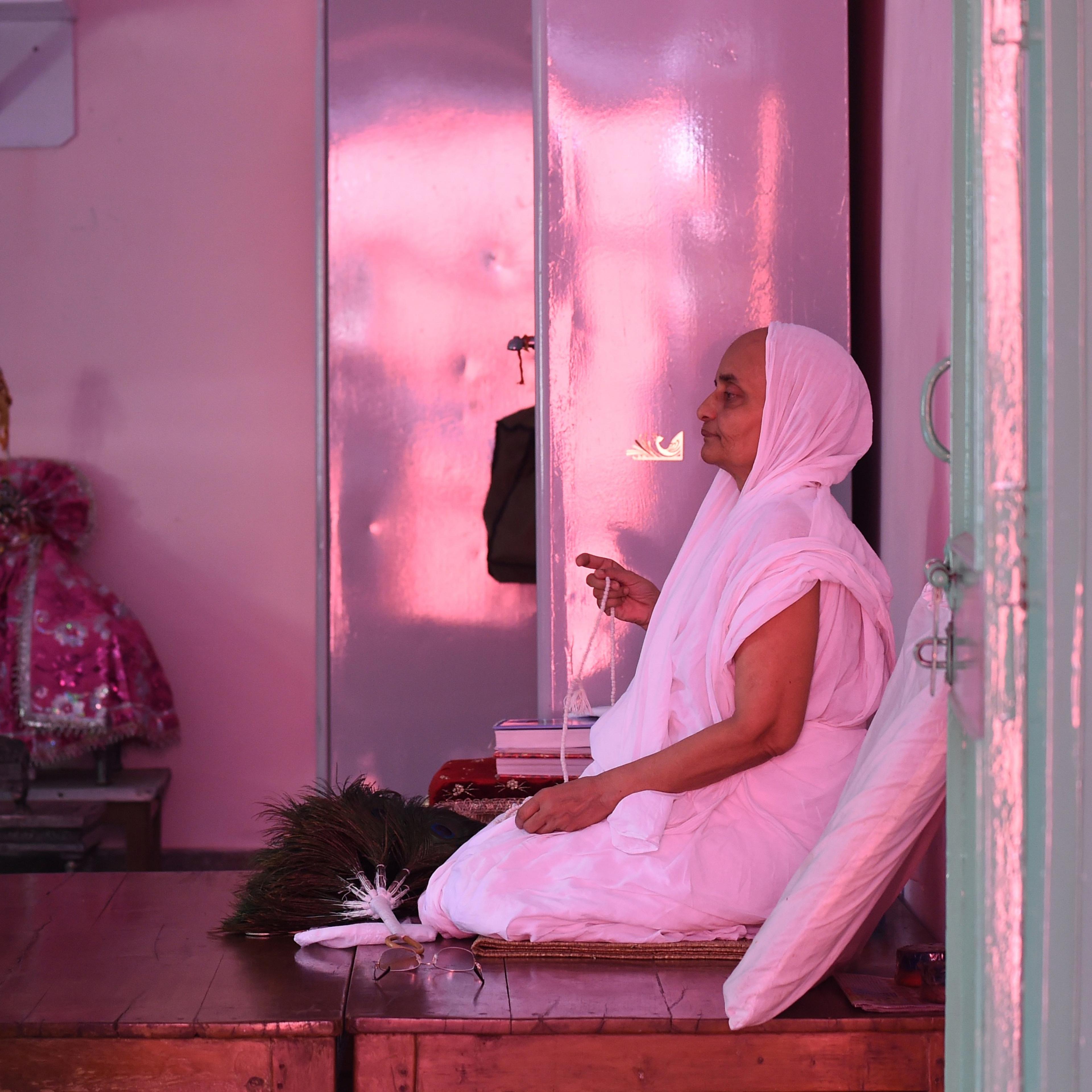 A Jain Sadhu (Jain Nun) prays in a room at the Jain Temple in the old quarters of New Delhi on August 31, 2015.