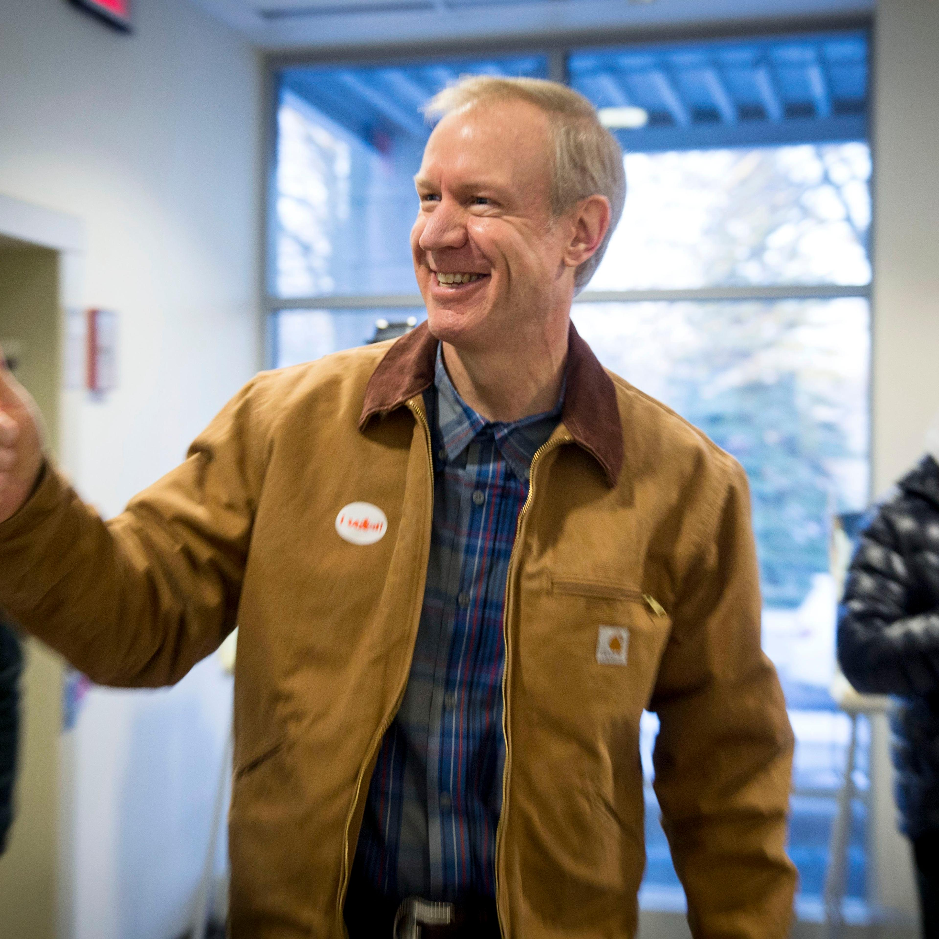 Illinois Republican gubernatorial candidate Bruce Rauner exits the polling place after voting in Winnetka, Ill.