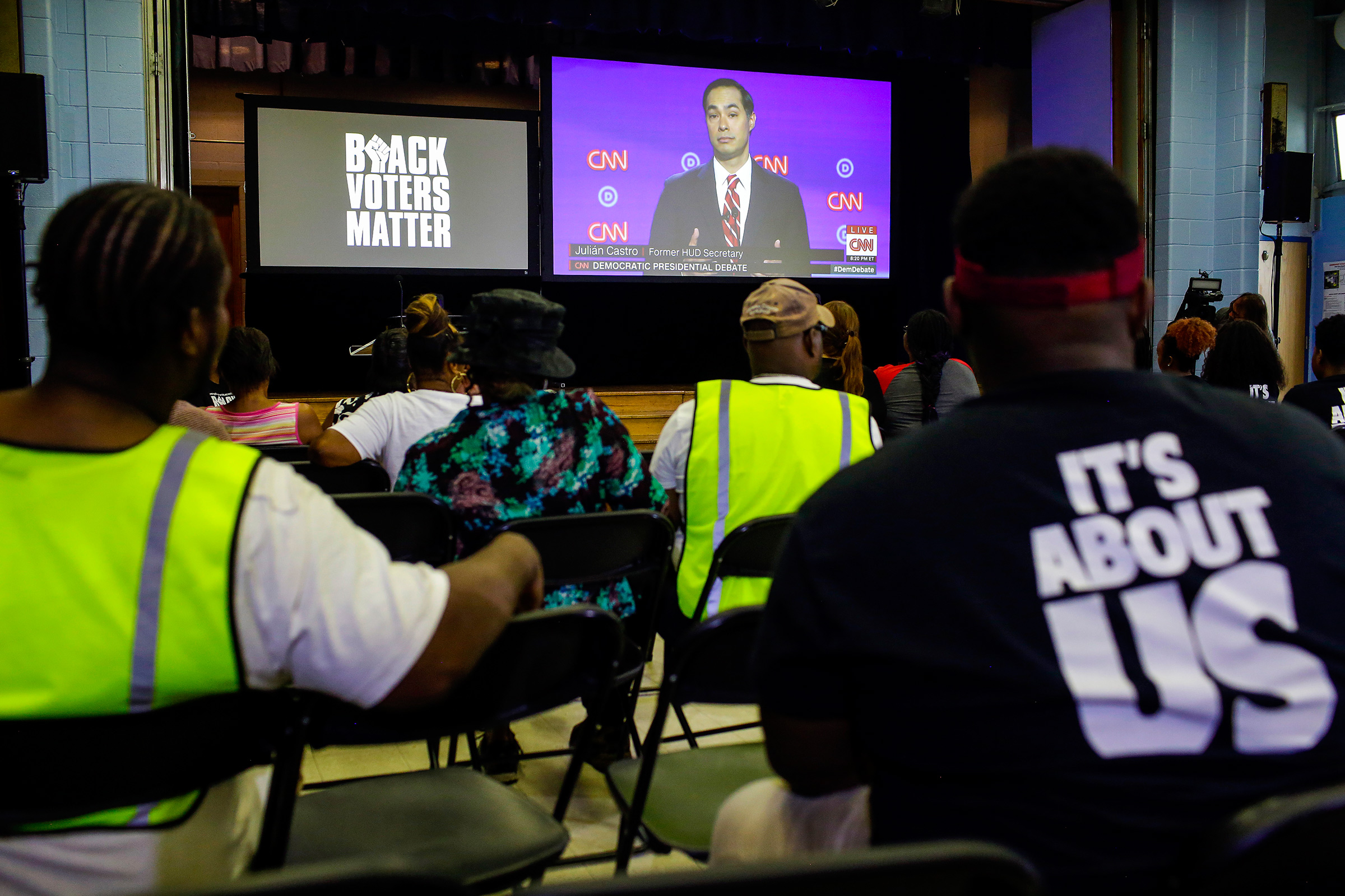 Attendees and residents of Flint watch the Presidential Debate during a watch party organized by Black Voters Matter at the Flint Development Center on July 31 in Flint, Michigan.