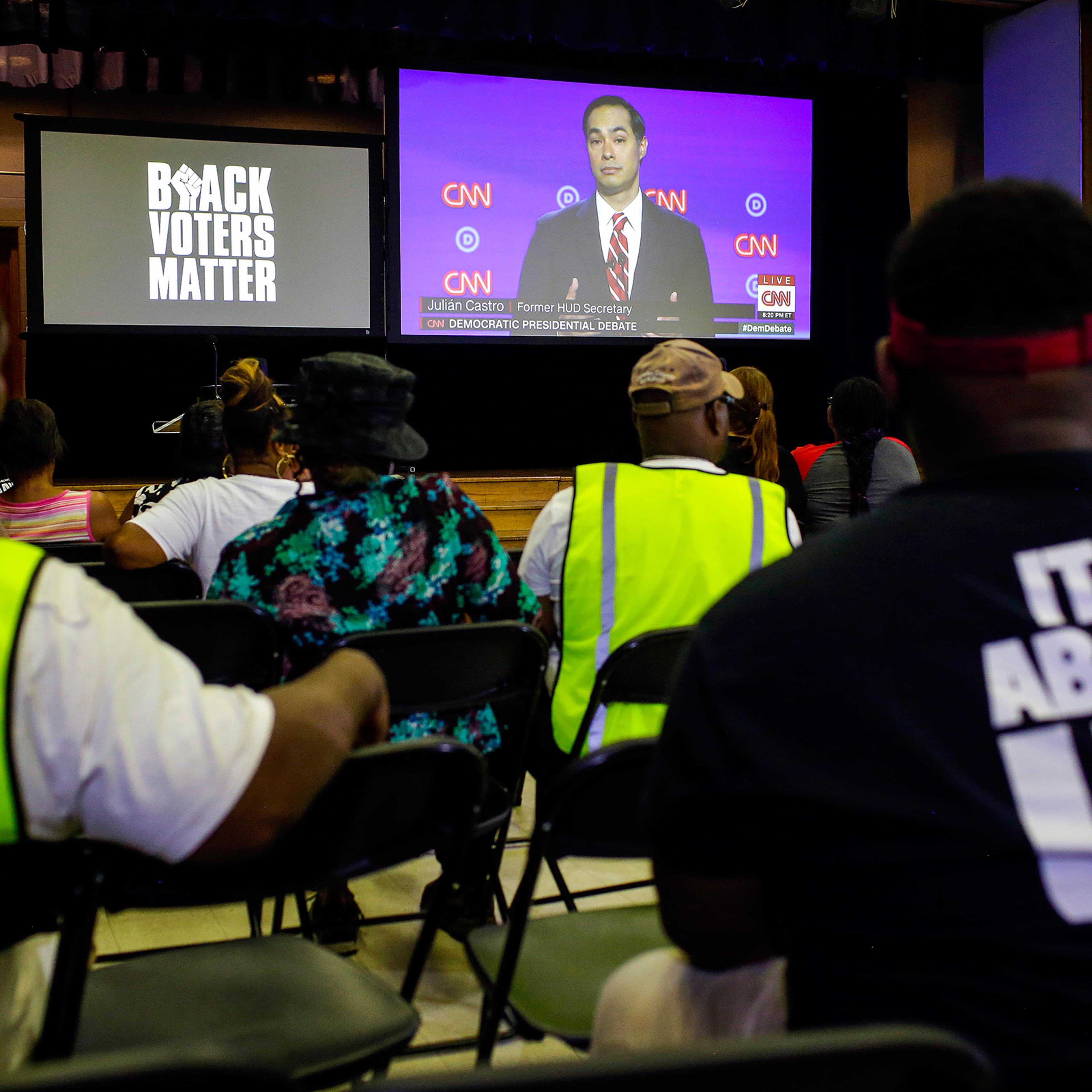 Attendees and residents of Flint watch the Presidential Debate during a watch party organized by Black Voters Matter at the Flint Development Center on July 31 in Flint, Michigan.