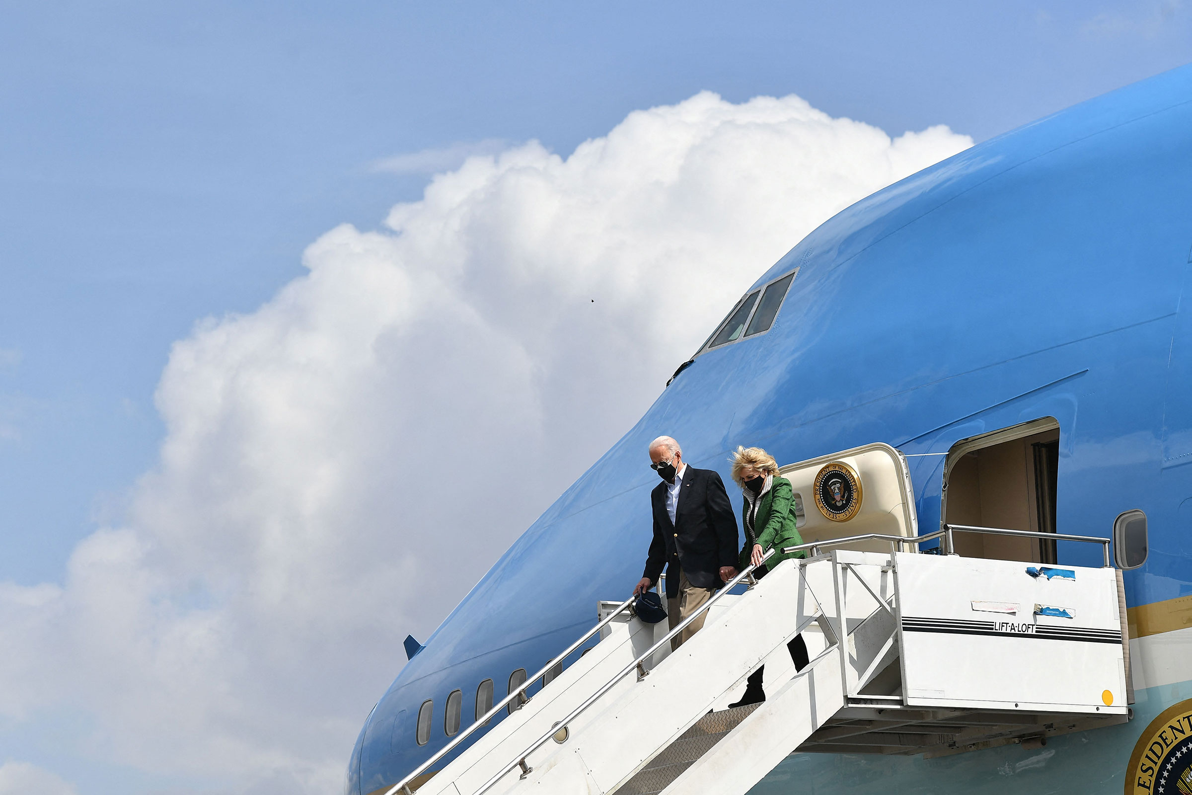 President Joe Biden and First Lady Jill Biden step off Air Force One upon arrival at Ellington Field Joint Reserve Base in Houston, Texas on Feb. 26, 2021.