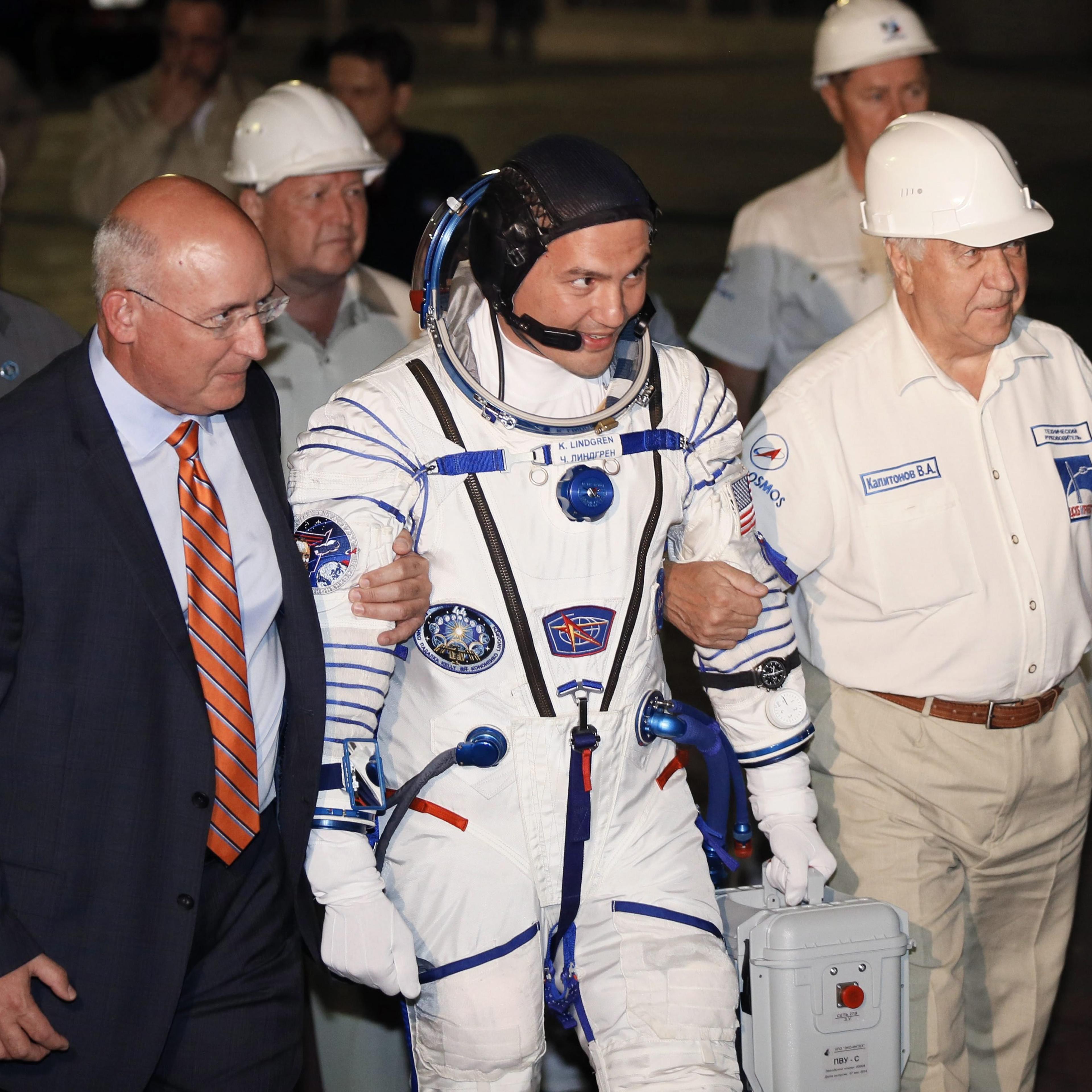 NASA astronaut Kjell Lindgren boards the Soyuz before launching to the ISS, in Baikonur, Kazakhstan, on July 22.
