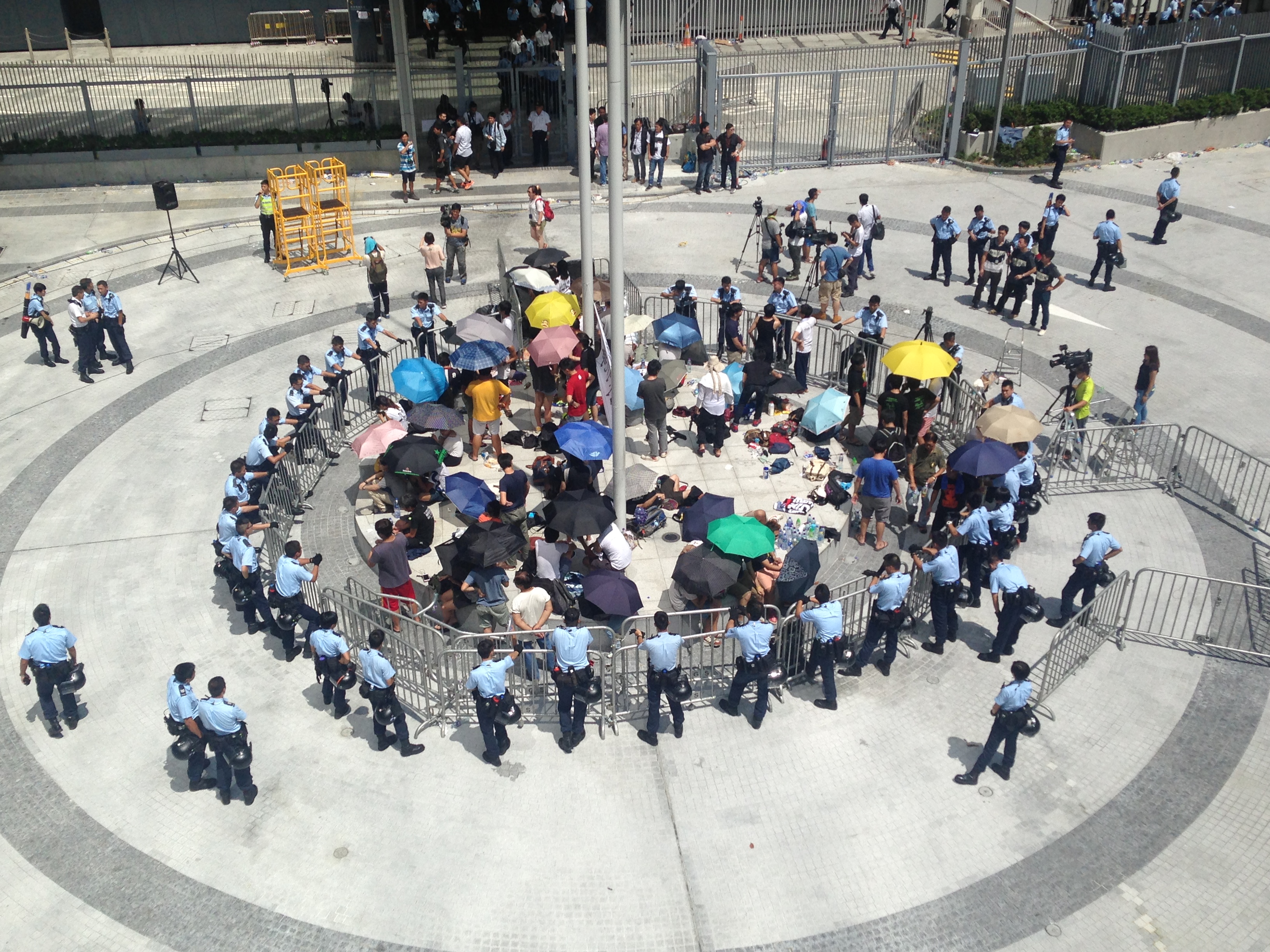 Hong Kong student protesters surrounded by police in the city's Civic Square on Saturday, Sept. 27, 2014. 