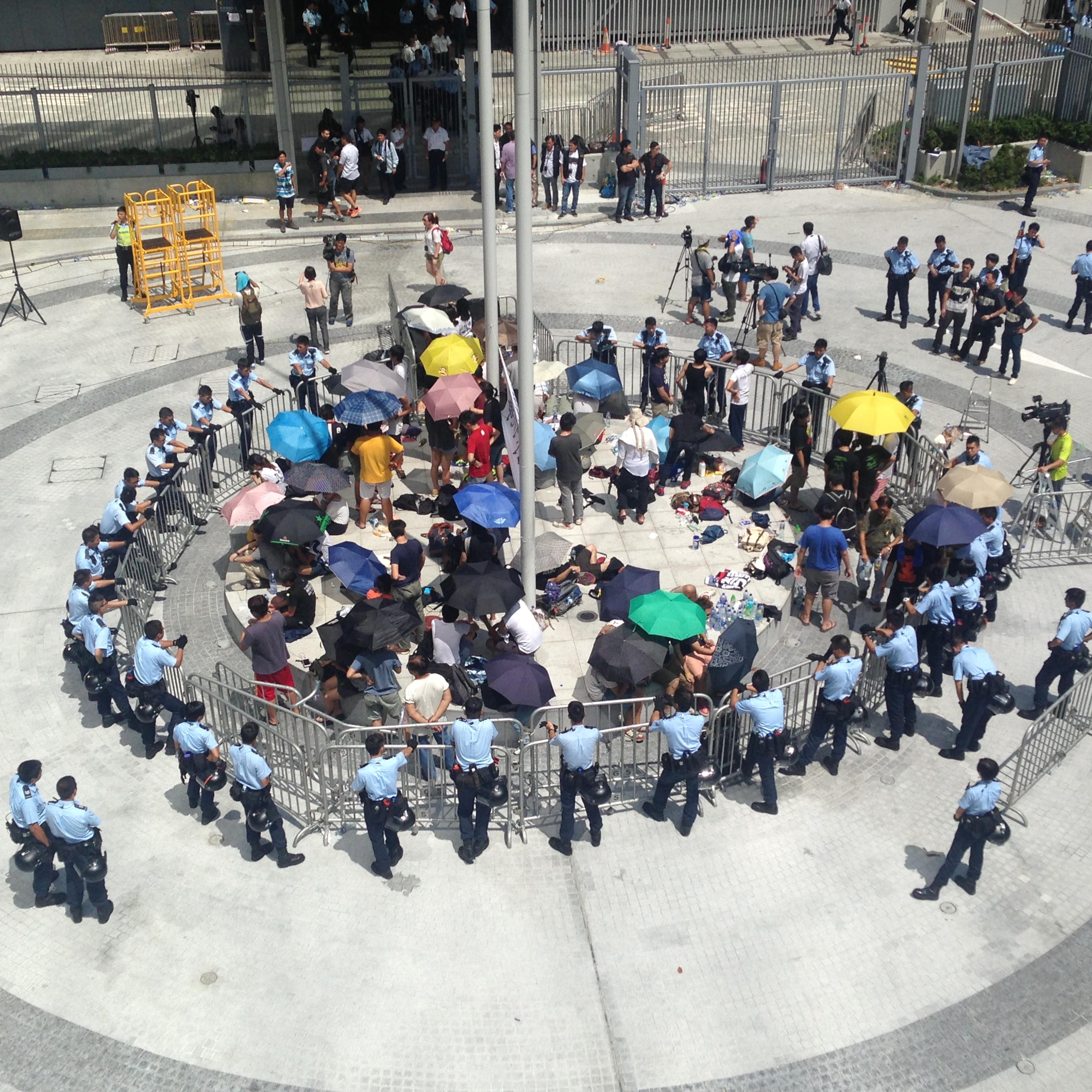 Hong Kong student protesters surrounded by police in the city's Civic Square on Saturday, Sept. 27, 2014.