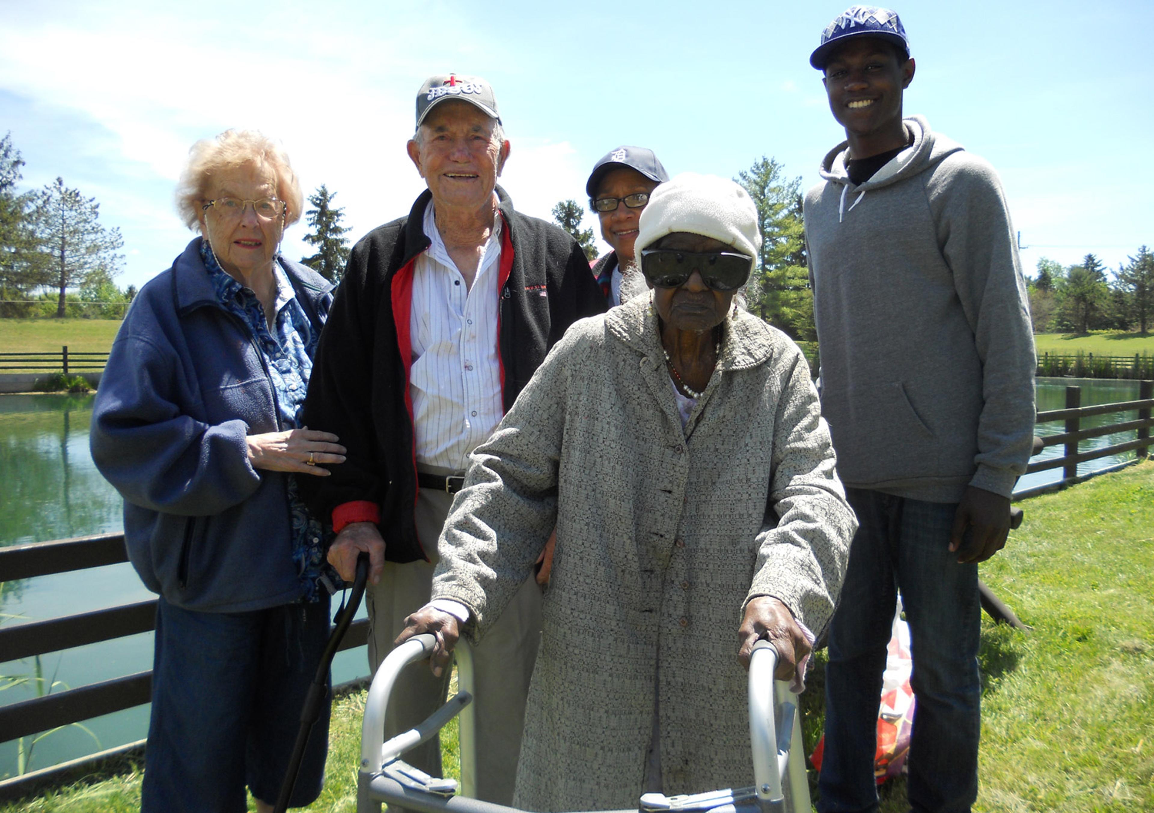 Talley with (L-R) the owners of Spring Valley Trout Farm in Dexter, Michigan, her friend Mary Kennedy, and her godson Tyler Kinloch, May 25, 2013.