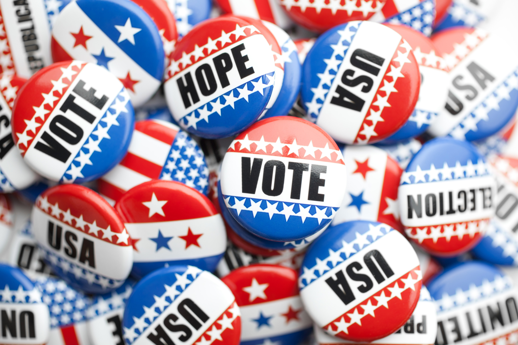 collection of political pins stacked