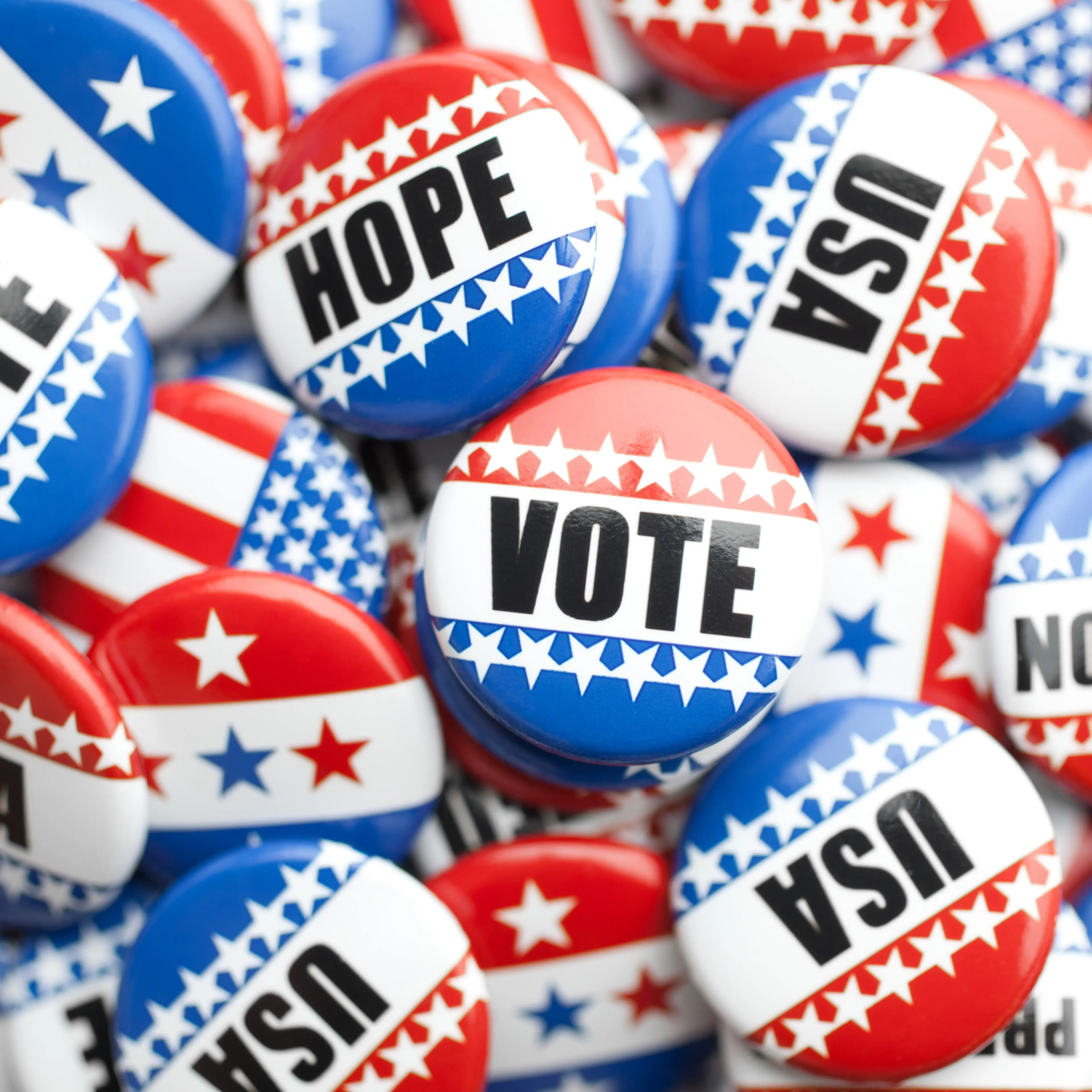 collection of political pins stacked