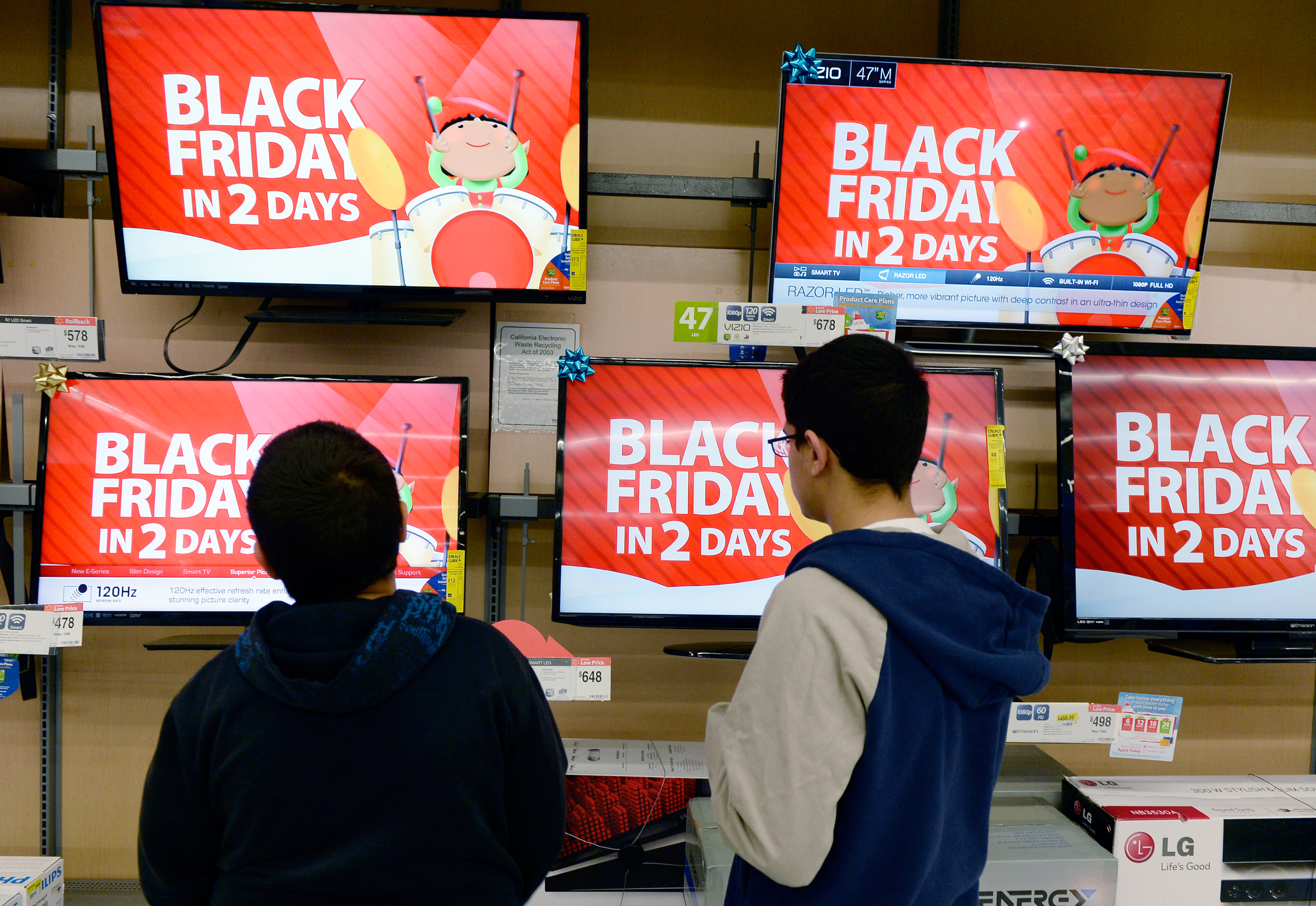 Customers shop at a Walmart store in the Porter Ranch section of Los Angeles November 26, 2013. This year, Black Friday starts earlier than ever.