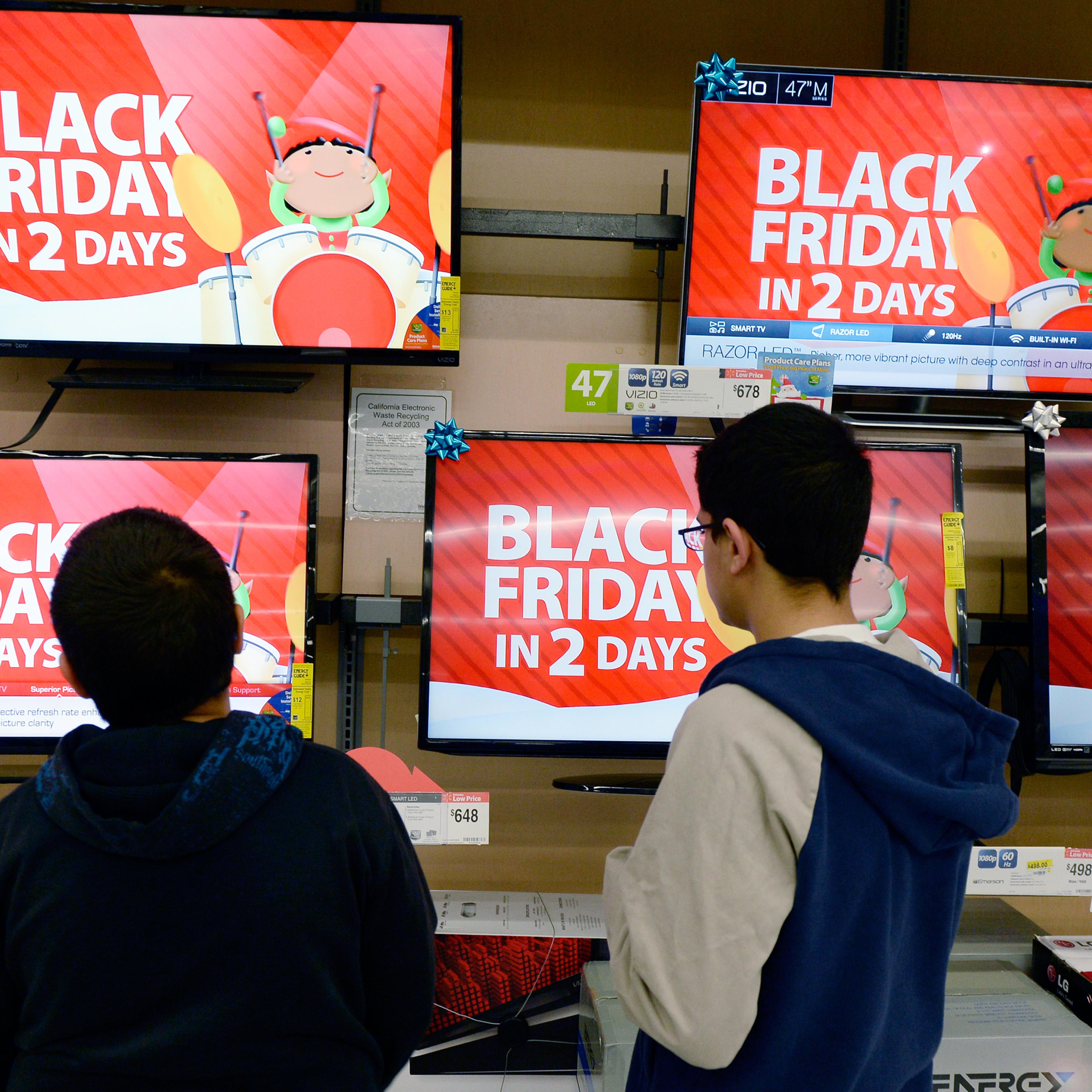 Customers shop at a Walmart store in the Porter Ranch section of Los Angeles November 26, 2013. This year, Black Friday starts earlier than ever.