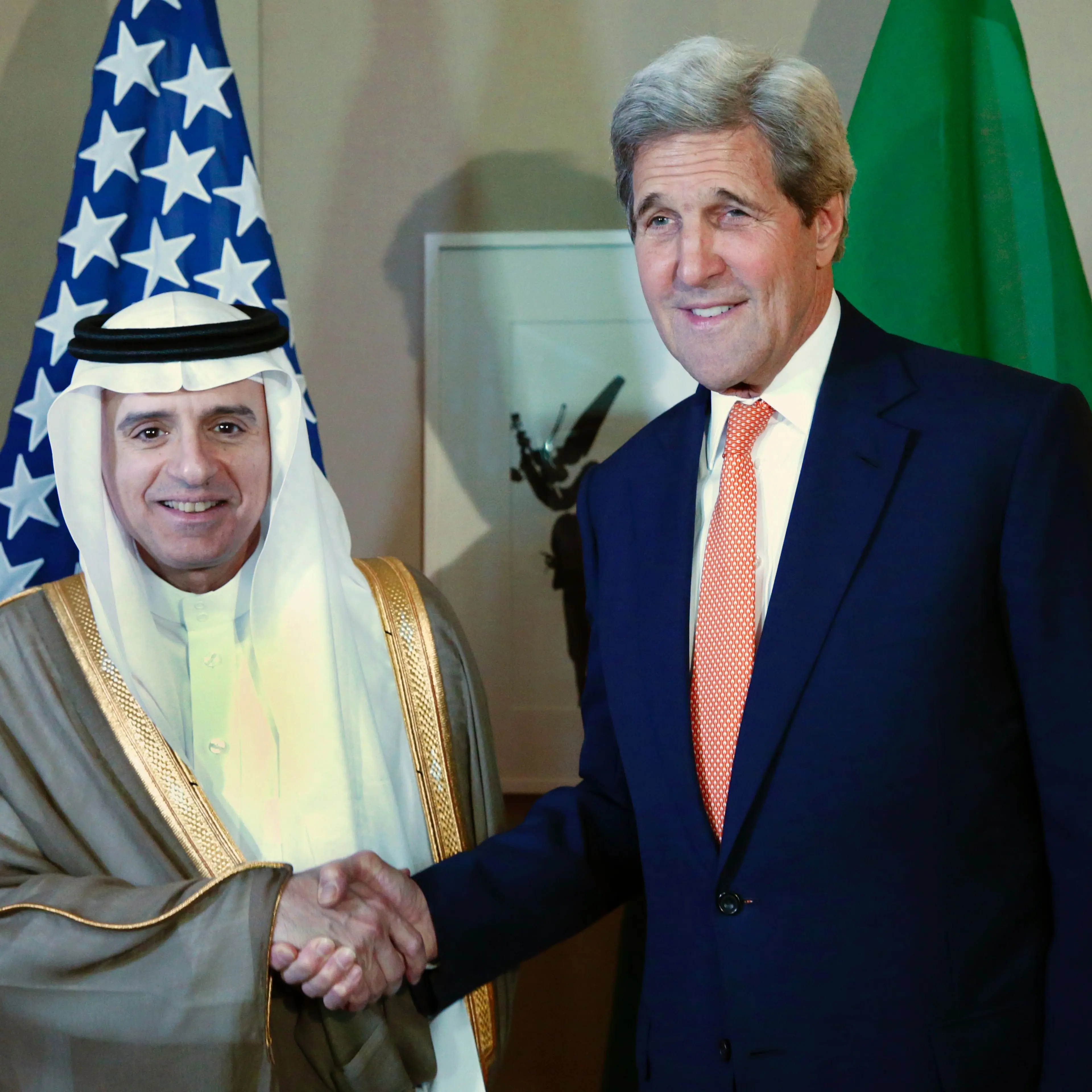 Saudi Foreign Minister Adel al-Jubeir shakes hand with US Secretary of State John Kerry during a meeting on Syria in Geneva, on May 2, 2016.