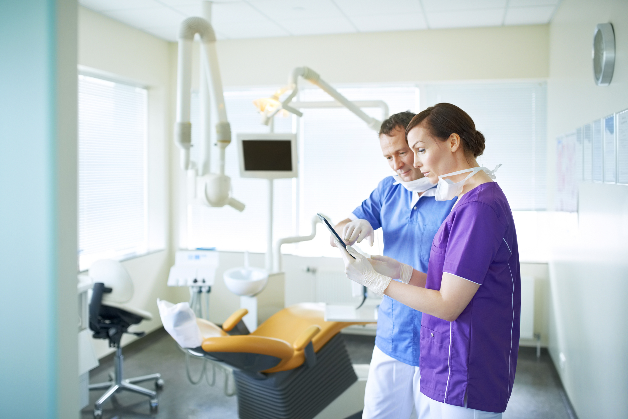 Two dentists comparing notes
