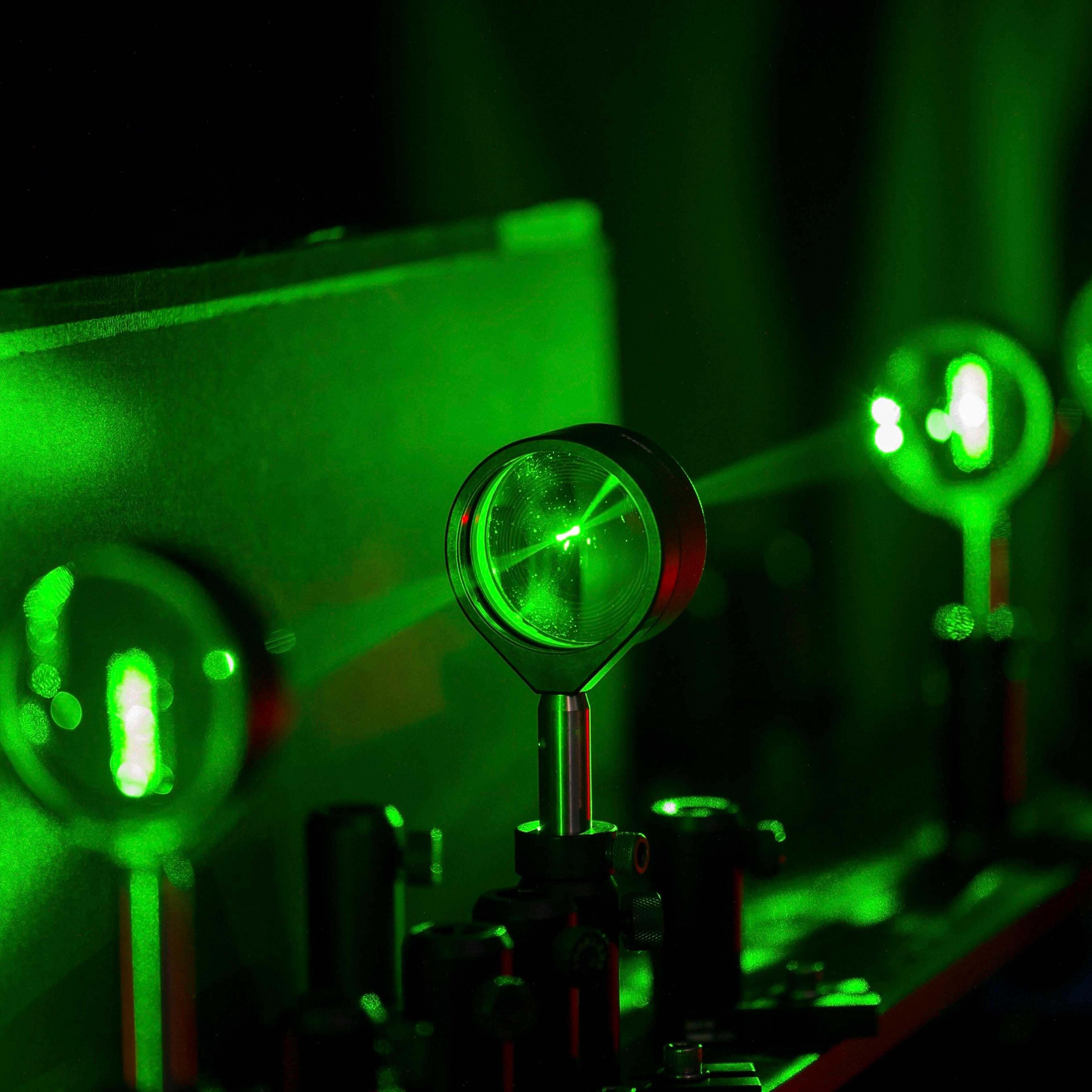 Handout photo of cloaking device using four lenses developed by University of Rochester physics professor Howell and graduate student Choi is demonstrated in Rochester