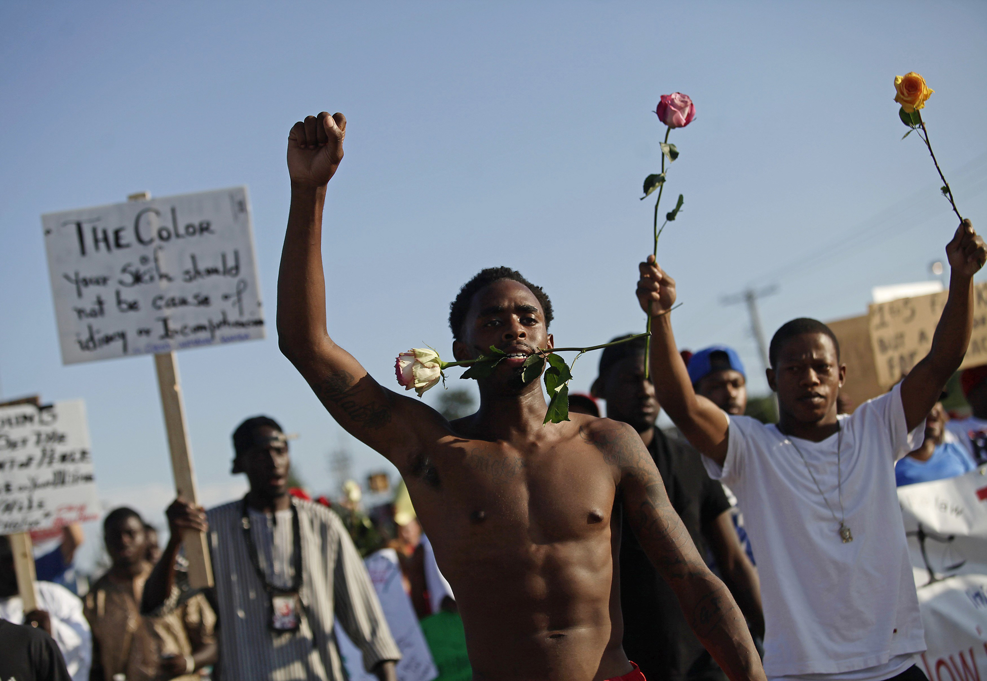 Demonstrators protest against the fatal shooting of Michael Brown in Ferguson, Mo. Aug. 19, 2014.