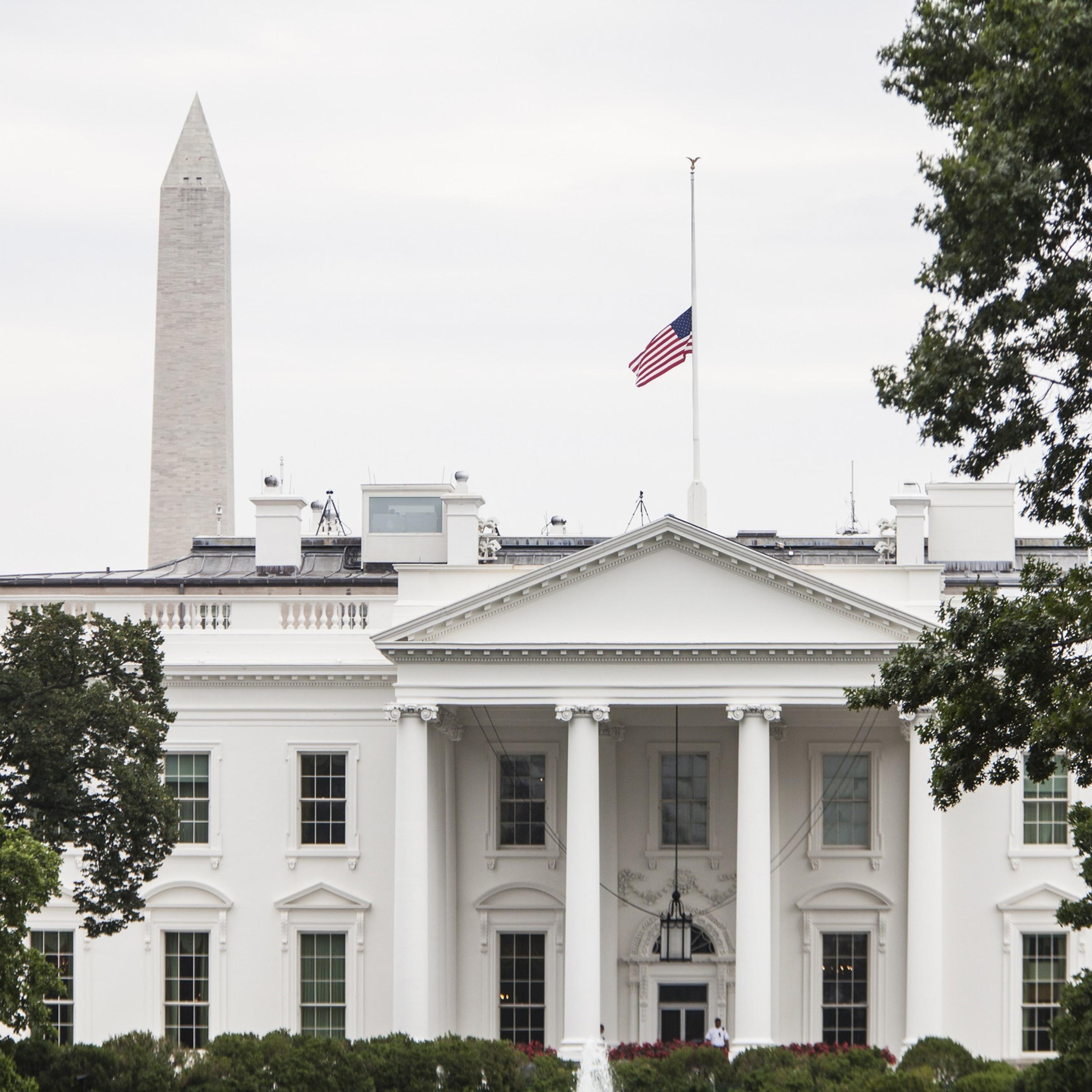 WASHINGTON, USA - JULY 21: The American Flag flies above the White House after President Barack Obama ordered it lowered to half staff in honor of the four Marines and one Sailor killed in Chattanooga, TN in Washington, USA on JULY 21, 2015. (Photo by Sa