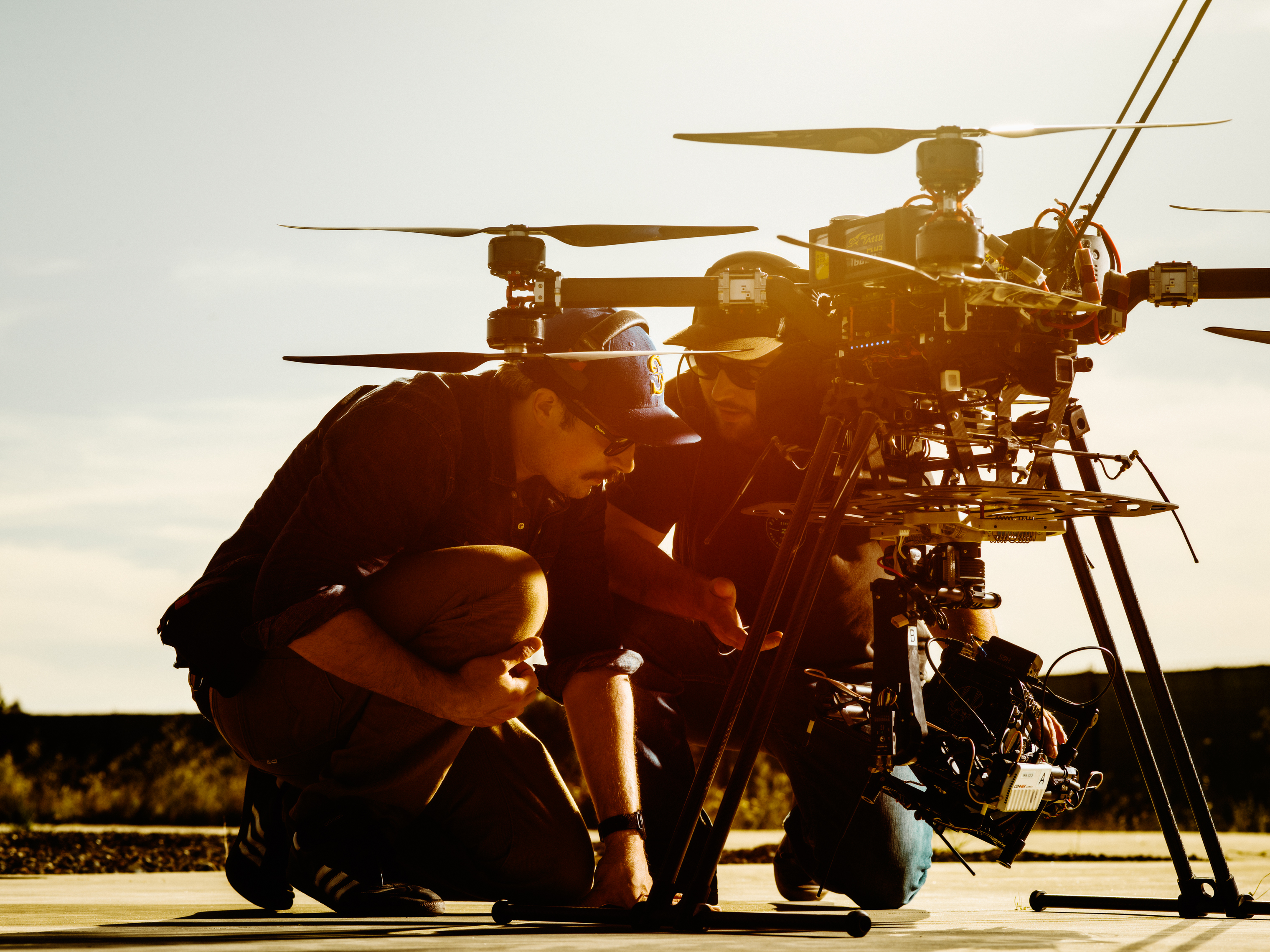 Second Pilot Travis Samson  and Pilot in Command Corey Gineris from Astraeus Aerial inspect the “Big Drone” used to shoot the cover video and image.
