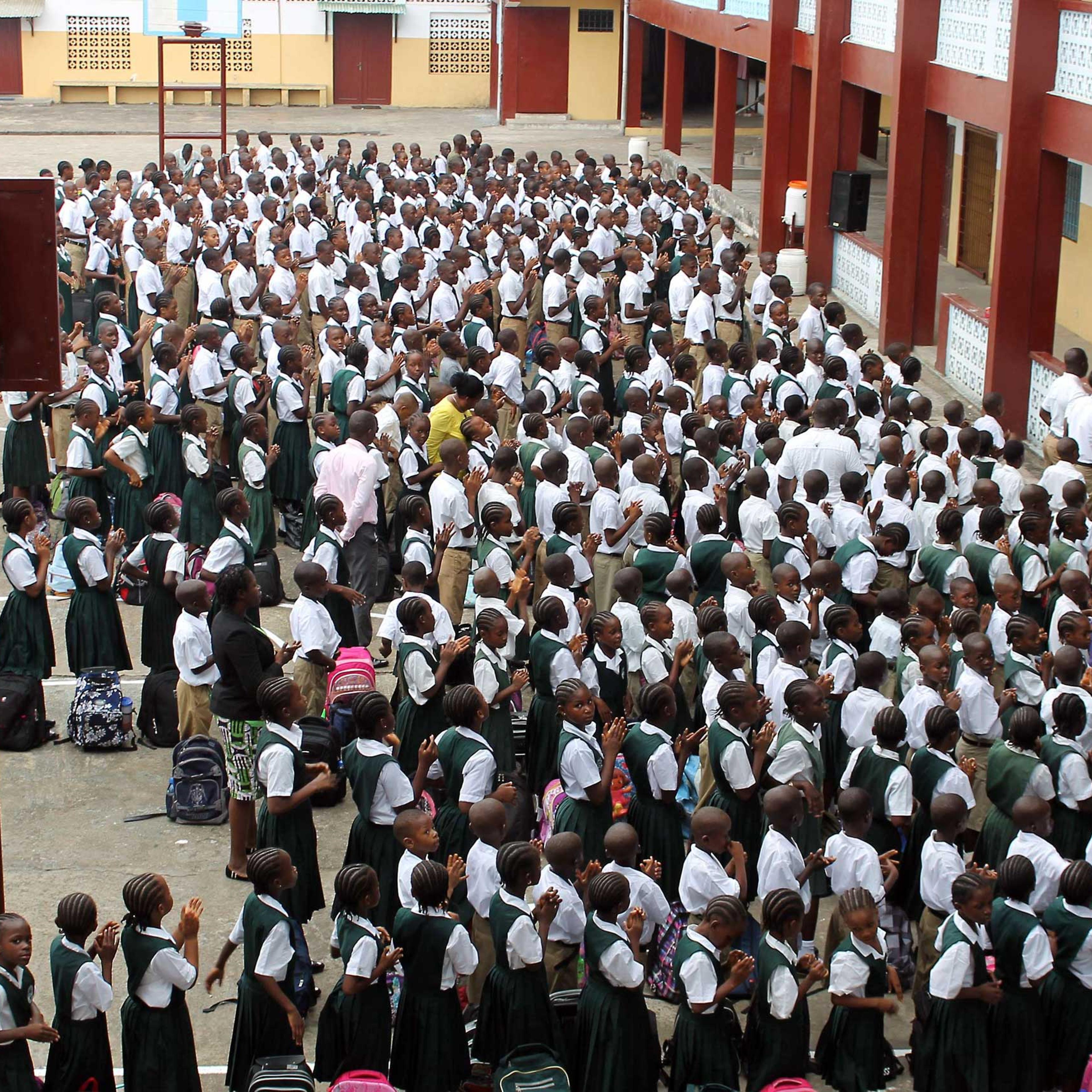 Students stand in line before heading to their classrooms at Don Bosco High School in the Liberian capital Monrovia on Feb. 16, 2015.
