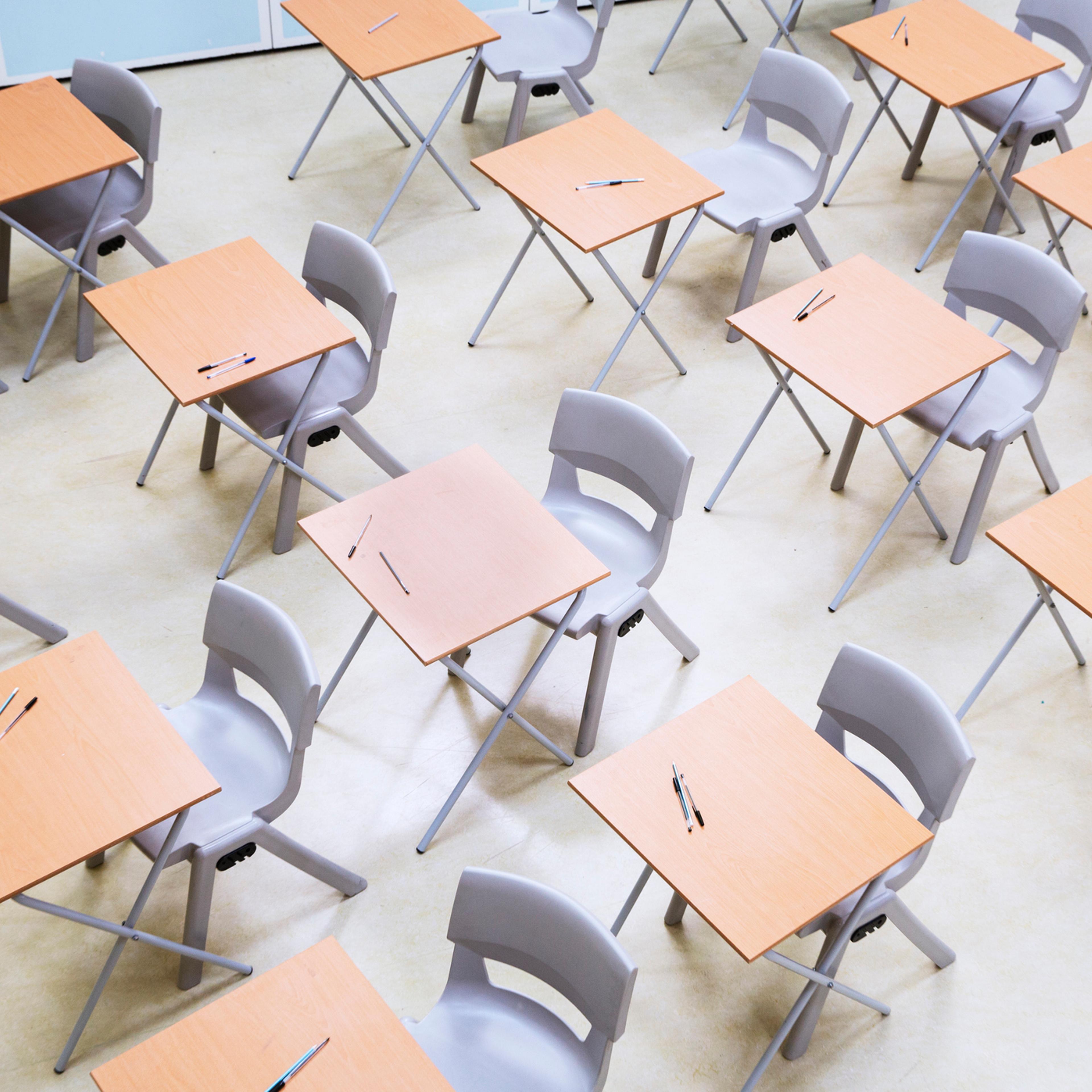 Elevated view of rows of desks and chairs in empty classroom