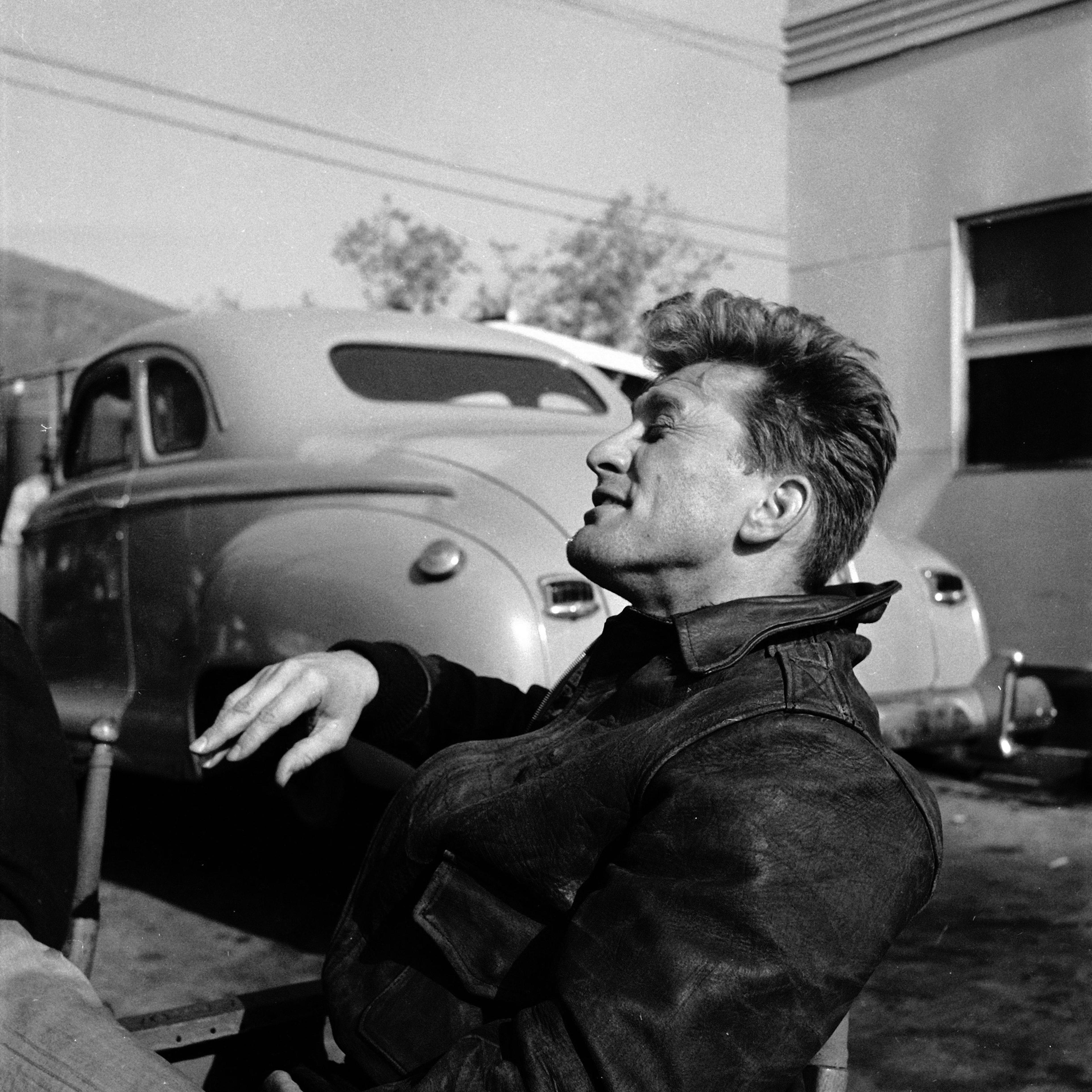 Kirk Douglas relaxing between takes on the set of the 1949 film, "Champion."