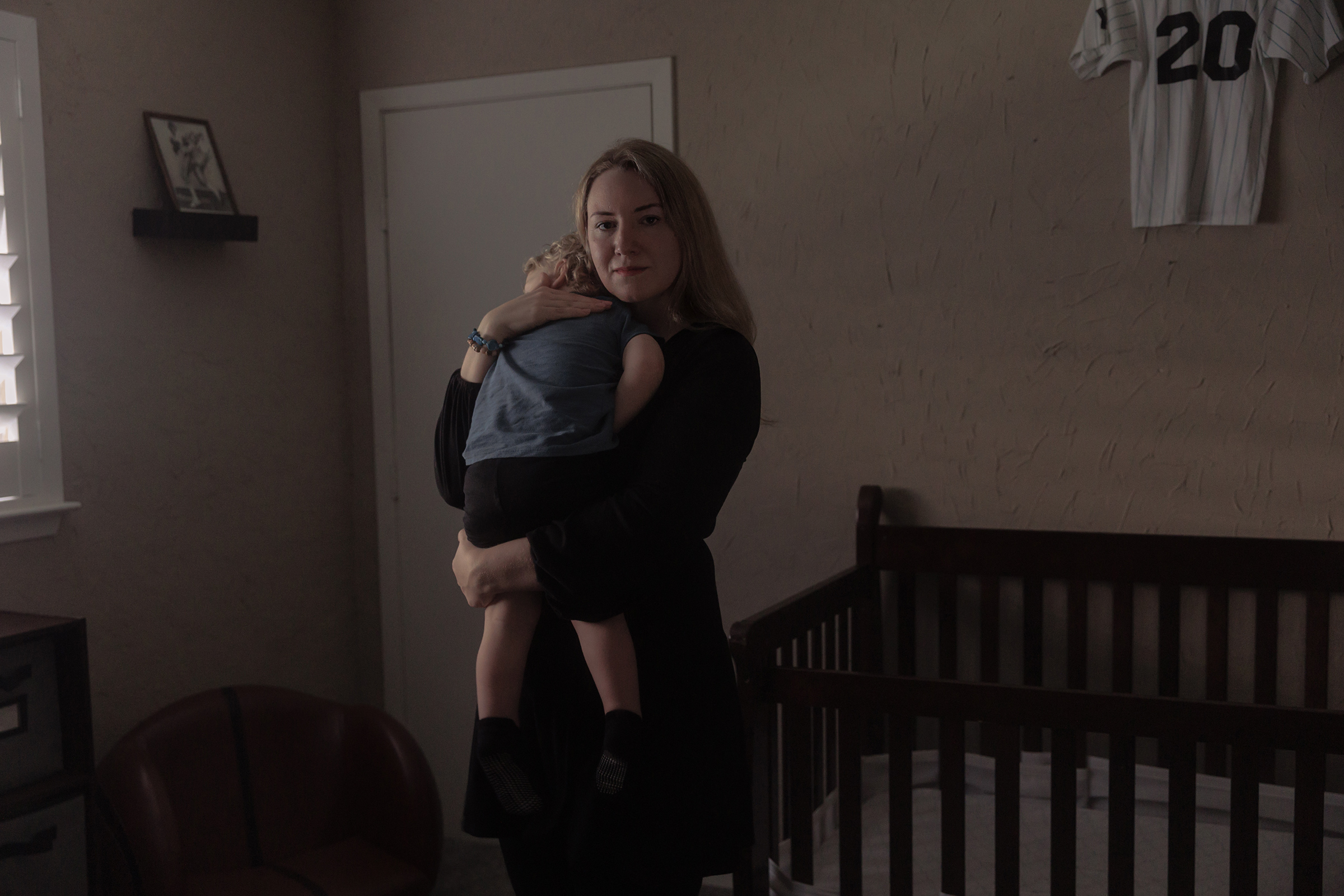 Kate Cox holds her son before putting him down for a nap at home on March 3.