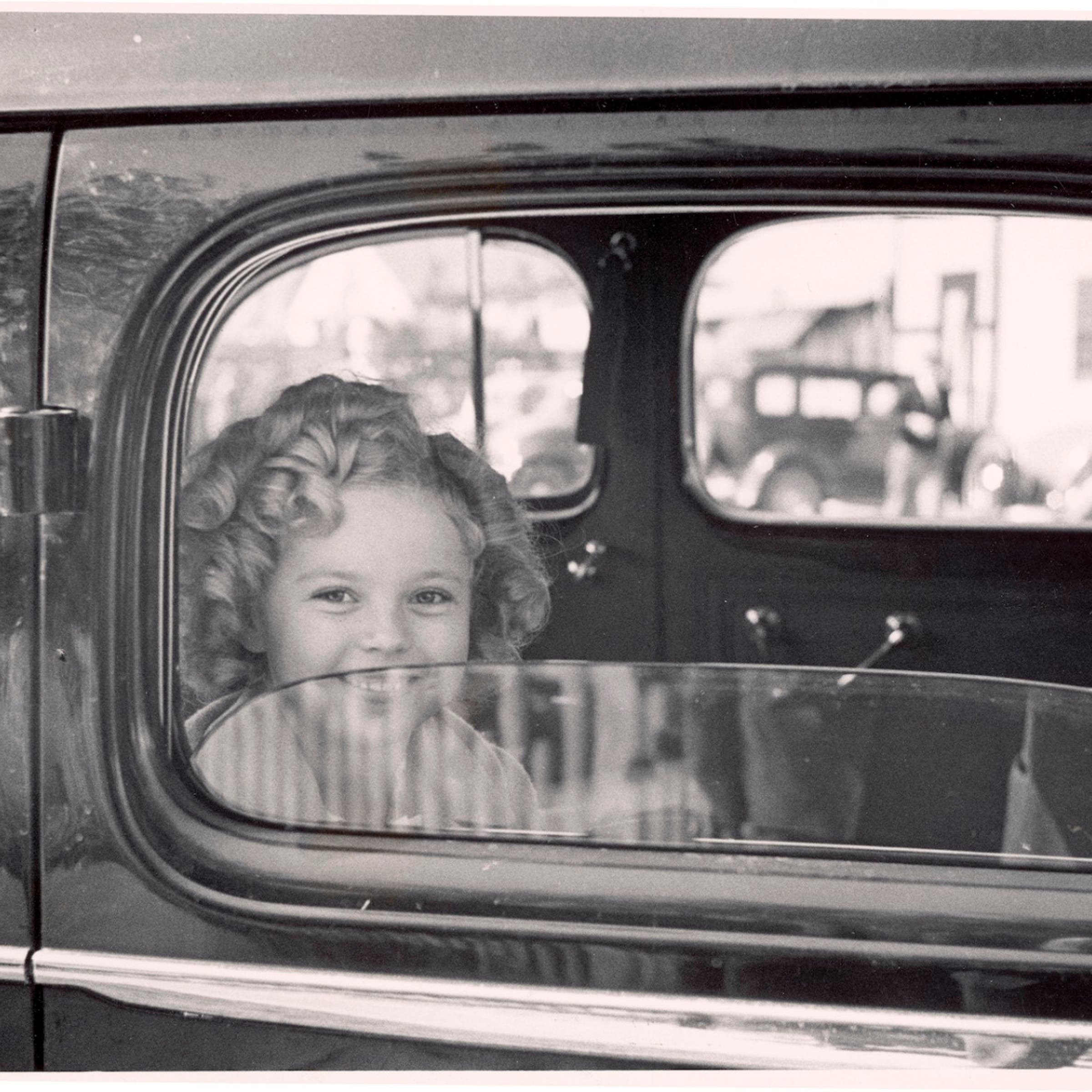 Shirley Temple arriving at 20th Century Fox film studio lot to celebrate her eighth birthday, in 1936.