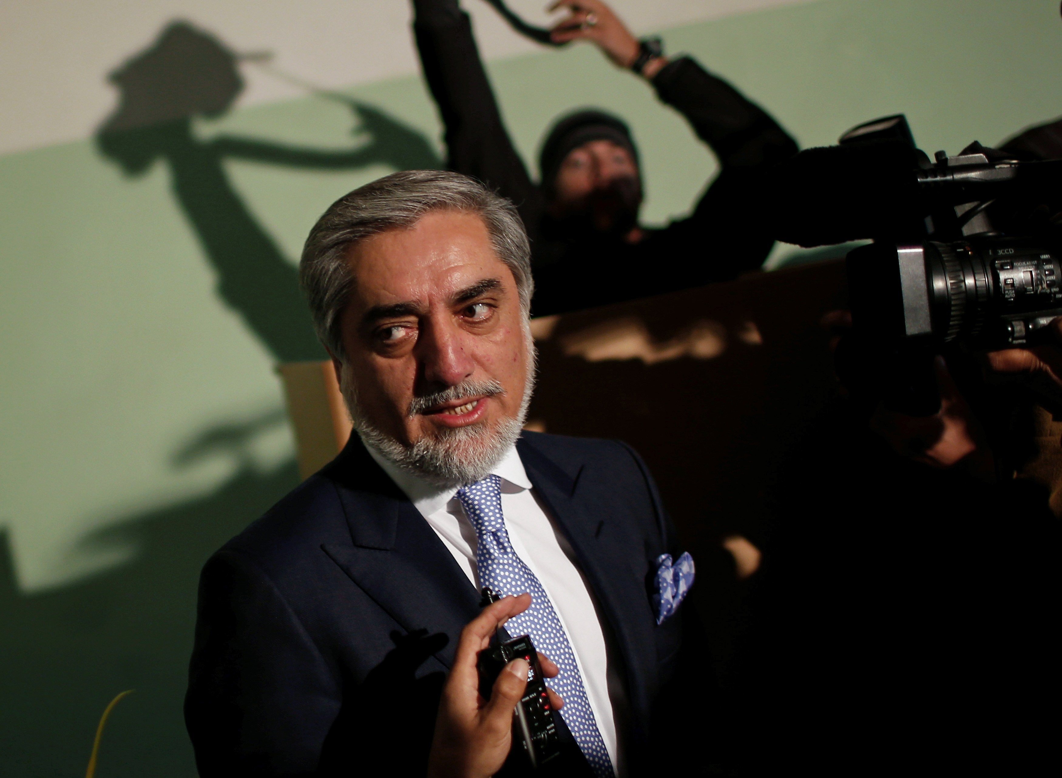 Presidential hopeful Abdullah Abdullah speaks to the media after casting his ballot