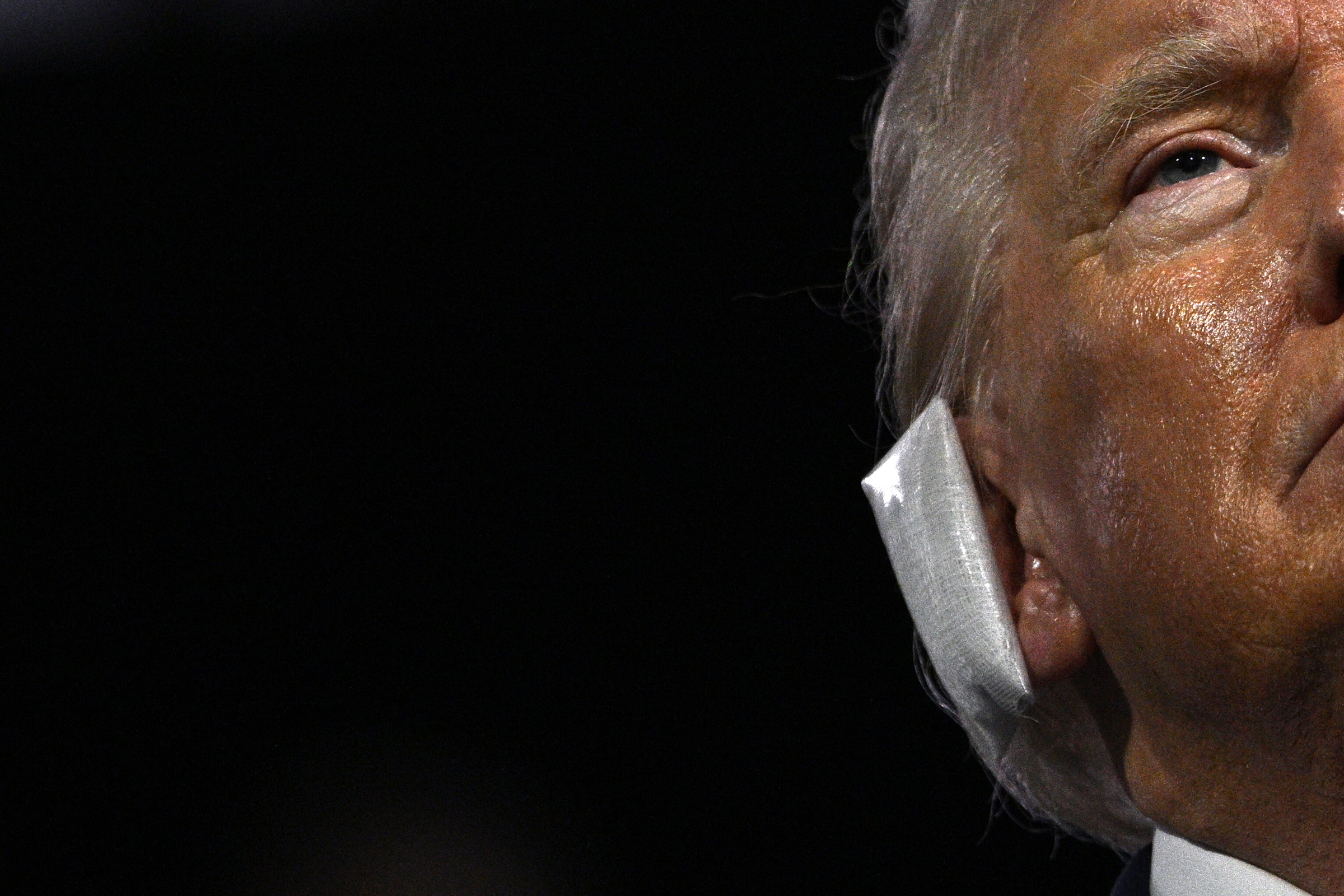 A bandage is seen on the ear of US former President Donald Trump after he was wounded in an assassination attempt during the first day of the 2024 Republican National Convention at the Fiserv Forum in Milwaukee, Wis., July 15, 2024.