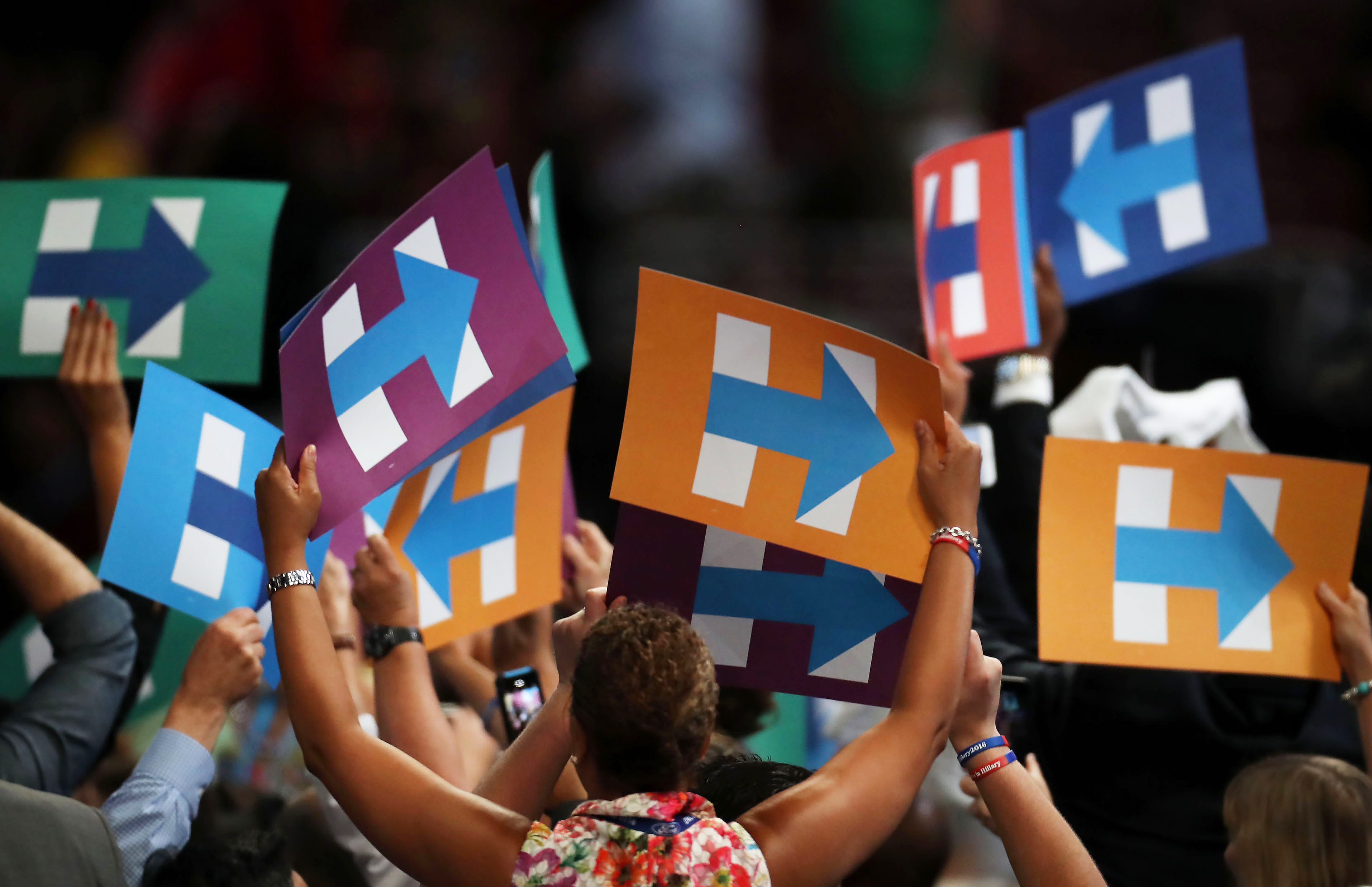 Delegates hold signs in support of Hillary Clinton during the Democratic National Convention in Philadelphia, on July 26, 2016.