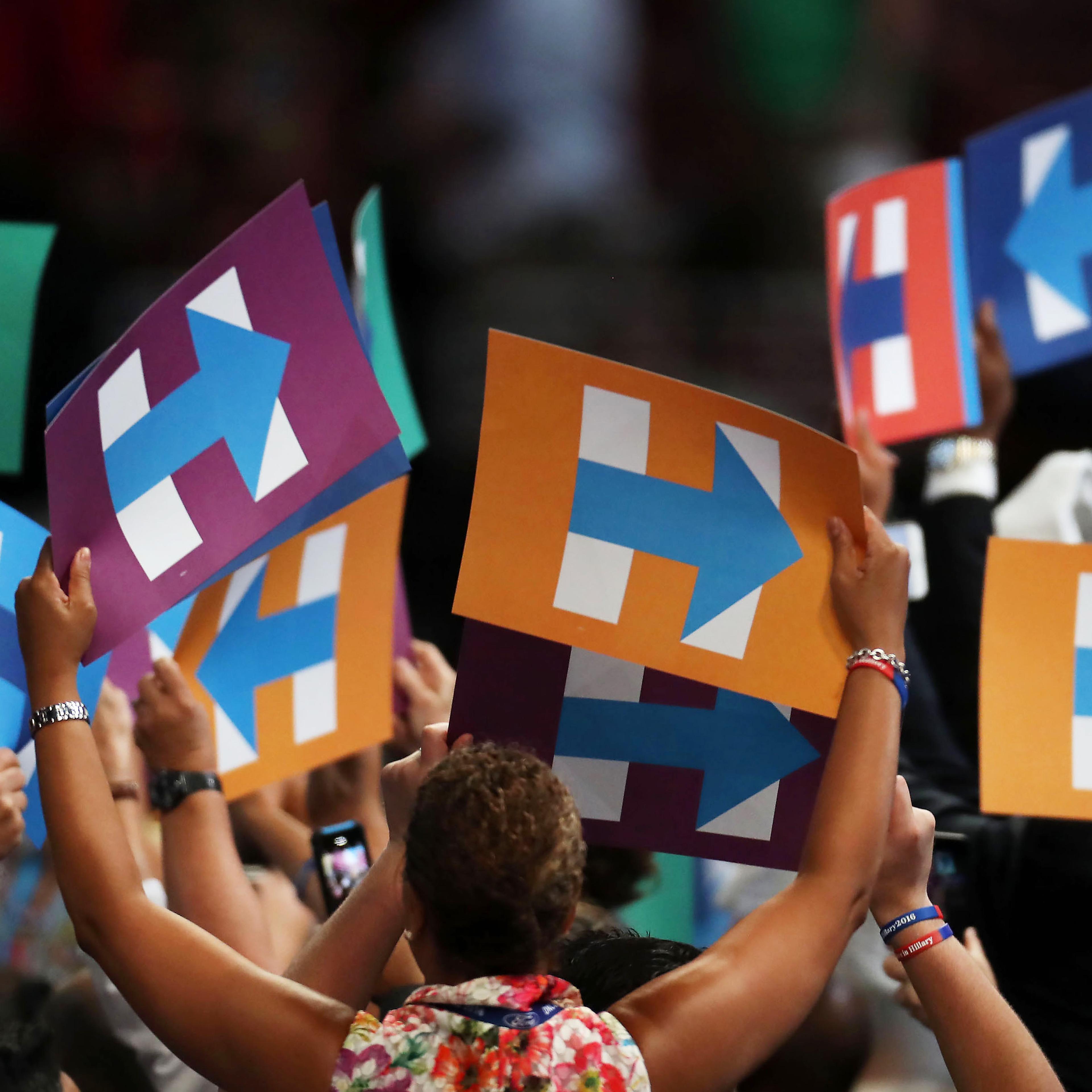 Delegates hold signs in support of Hillary Clinton during the Democratic National Convention in Philadelphia, on July 26, 2016.