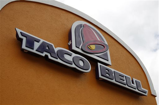 This May 23, 2014, file photo shows a sign at a Taco Bell in Mount Lebanon, Pa.