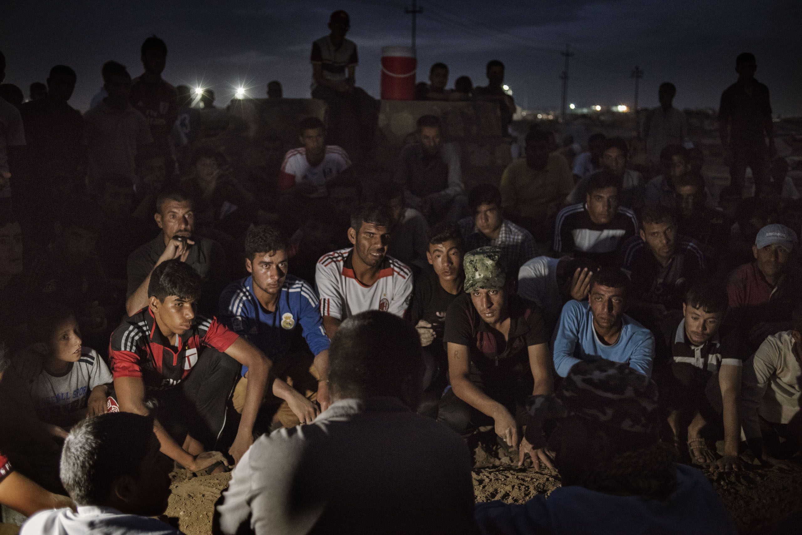 Men and boys dig a grave for a man named Ahmed Mohamed Ali, in a camp for internally displaced people (IDP's) near the Iraqi town of Makhmour, May 17, 2016. According to camp residents, Ali had been injured during the Iraqi military's offensive on ISIS-h