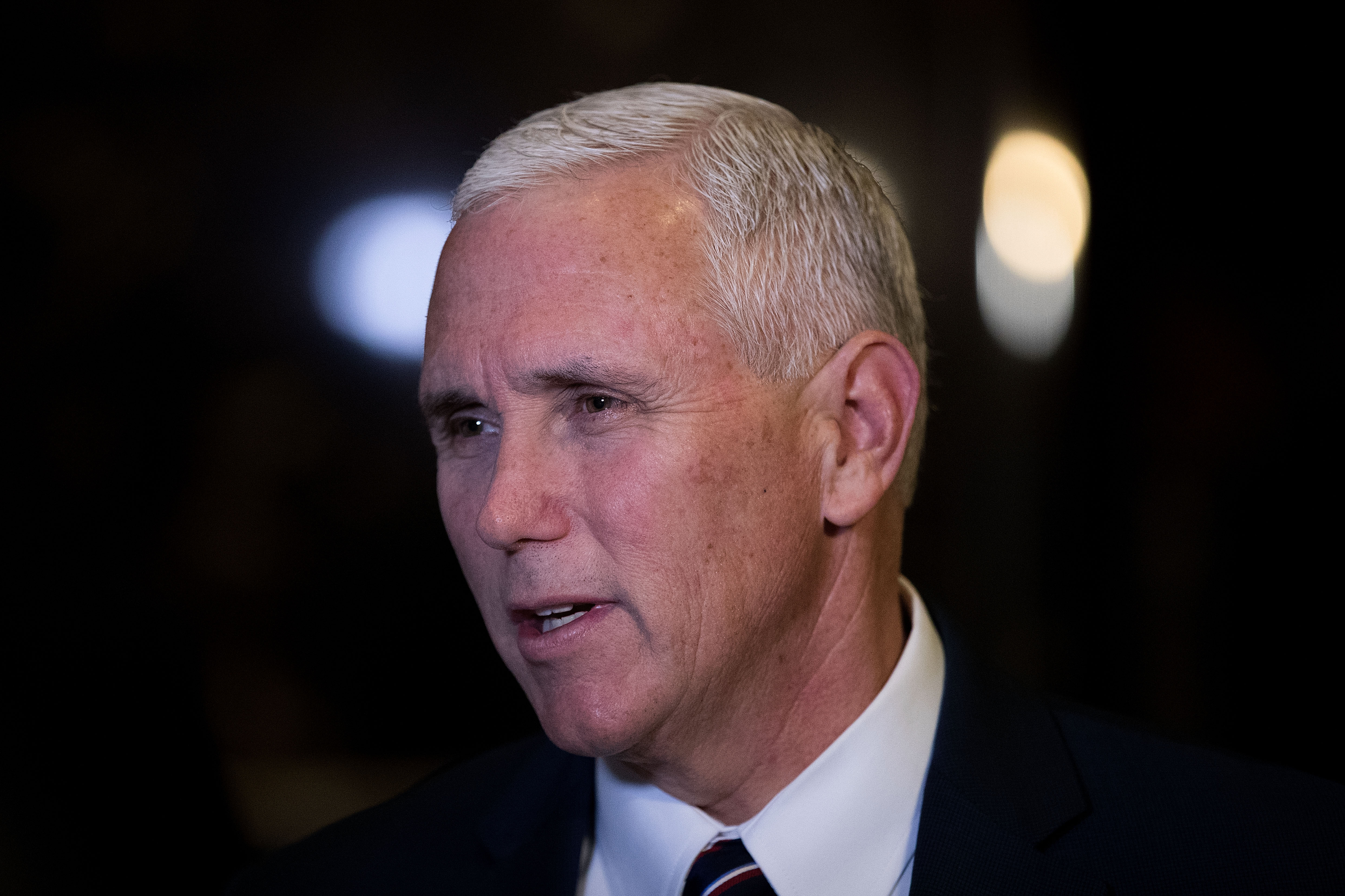 Vice President-elect Mike Pence stops and speaks briefly to reporters at Trump Tower in New York City on Nov. 18, 2016.