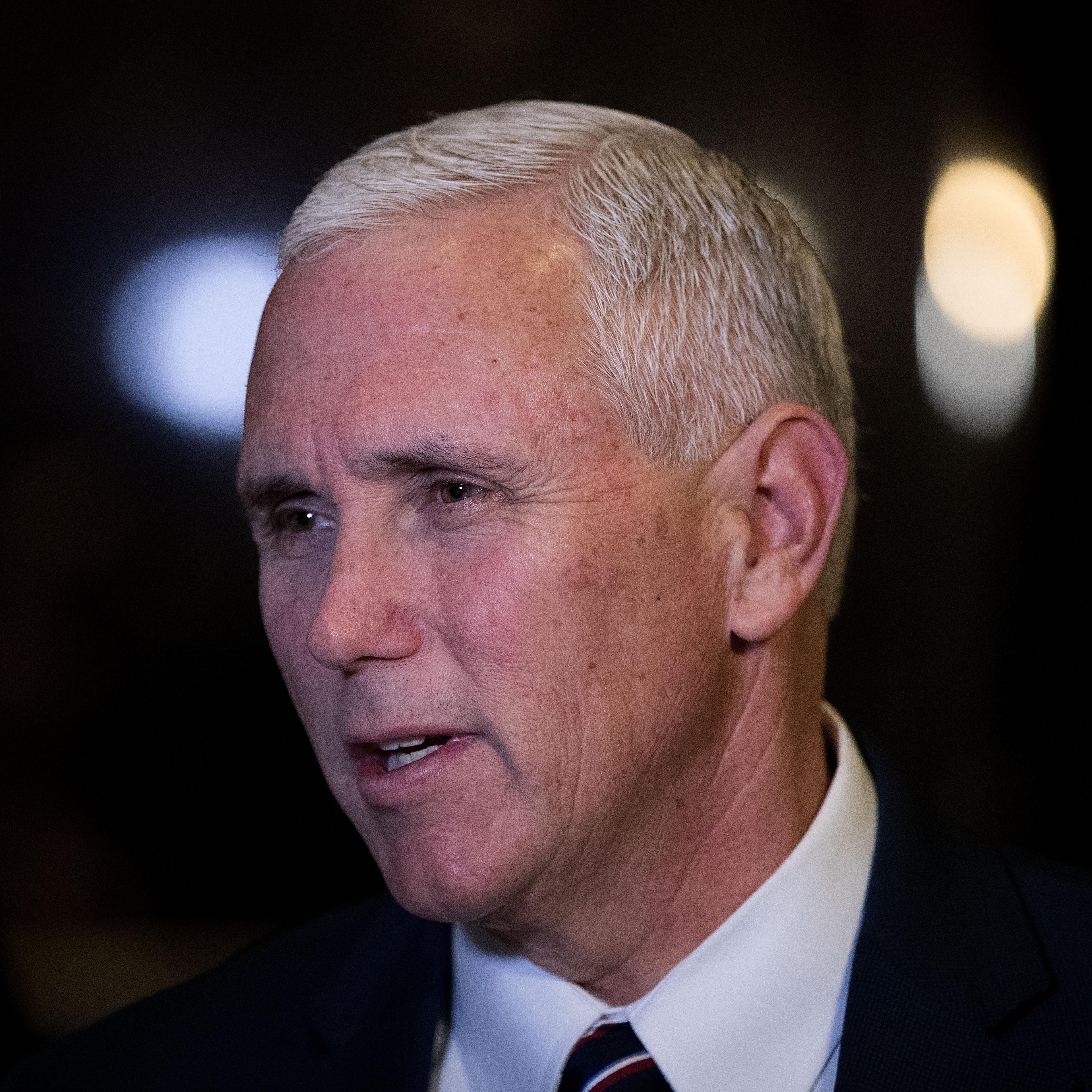 Vice President-elect Mike Pence stops and speaks briefly to reporters at Trump Tower in New York City on Nov. 18, 2016.