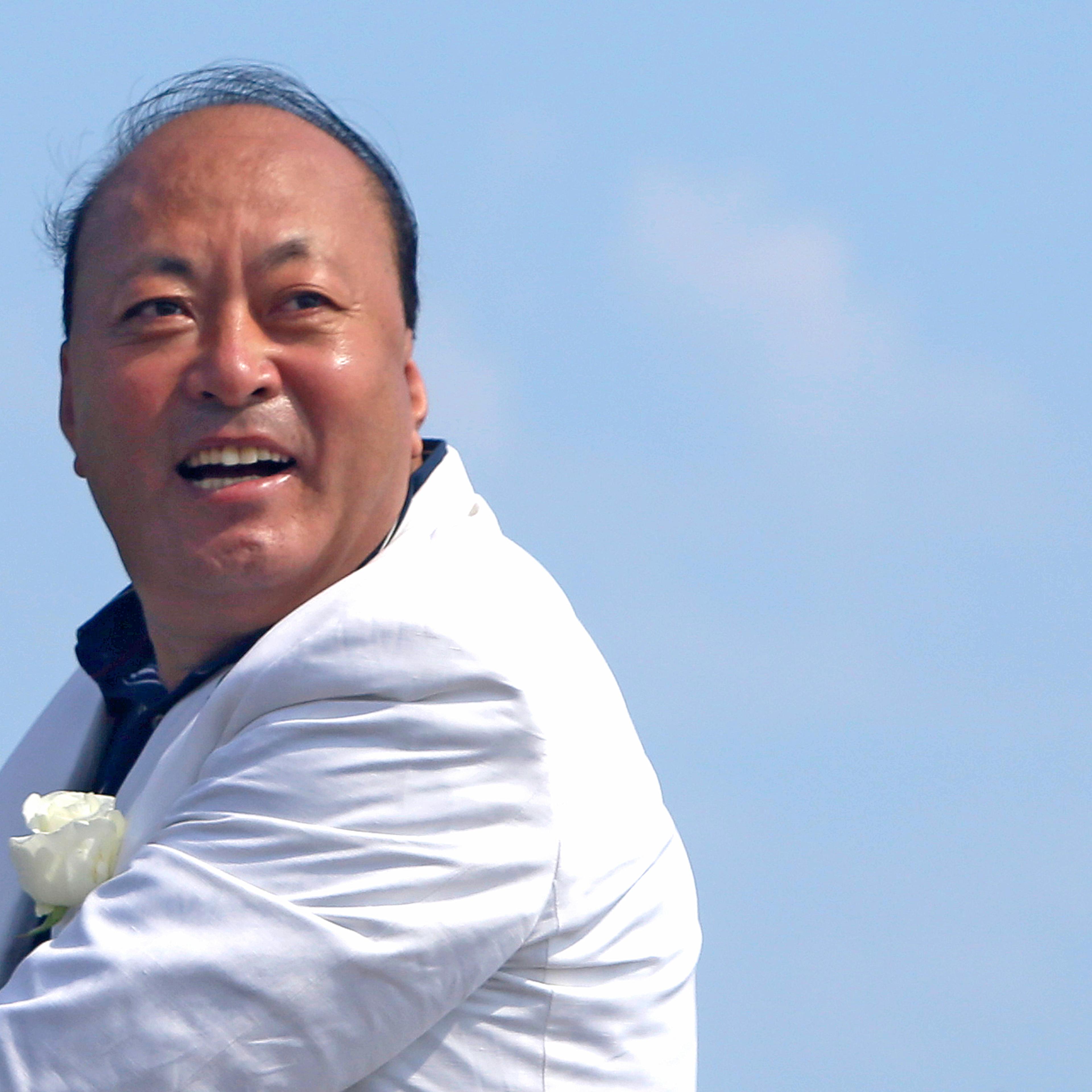 Chinese CEO of "Tiens" company Li Jinyuan poses during a parade on the Promenade des Anglais in Nice, southeastern France May 8, 2015