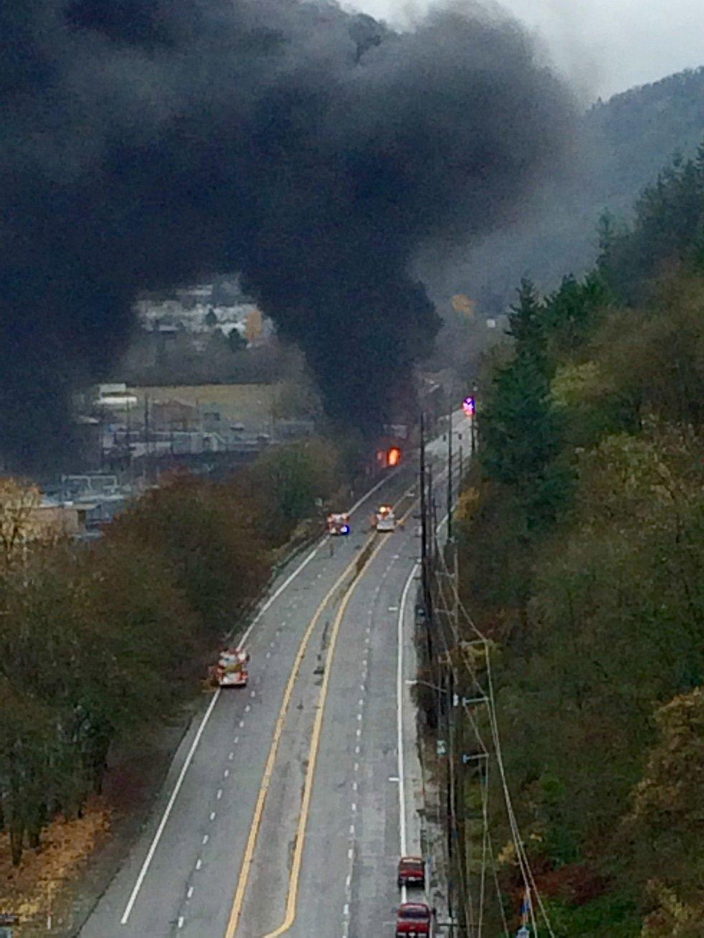 The scene of a of a traffic crash and fire involving a train along U.S. 30/St. Helens Road in Northwest Portland, Ore., on Dec. 13, 2015.