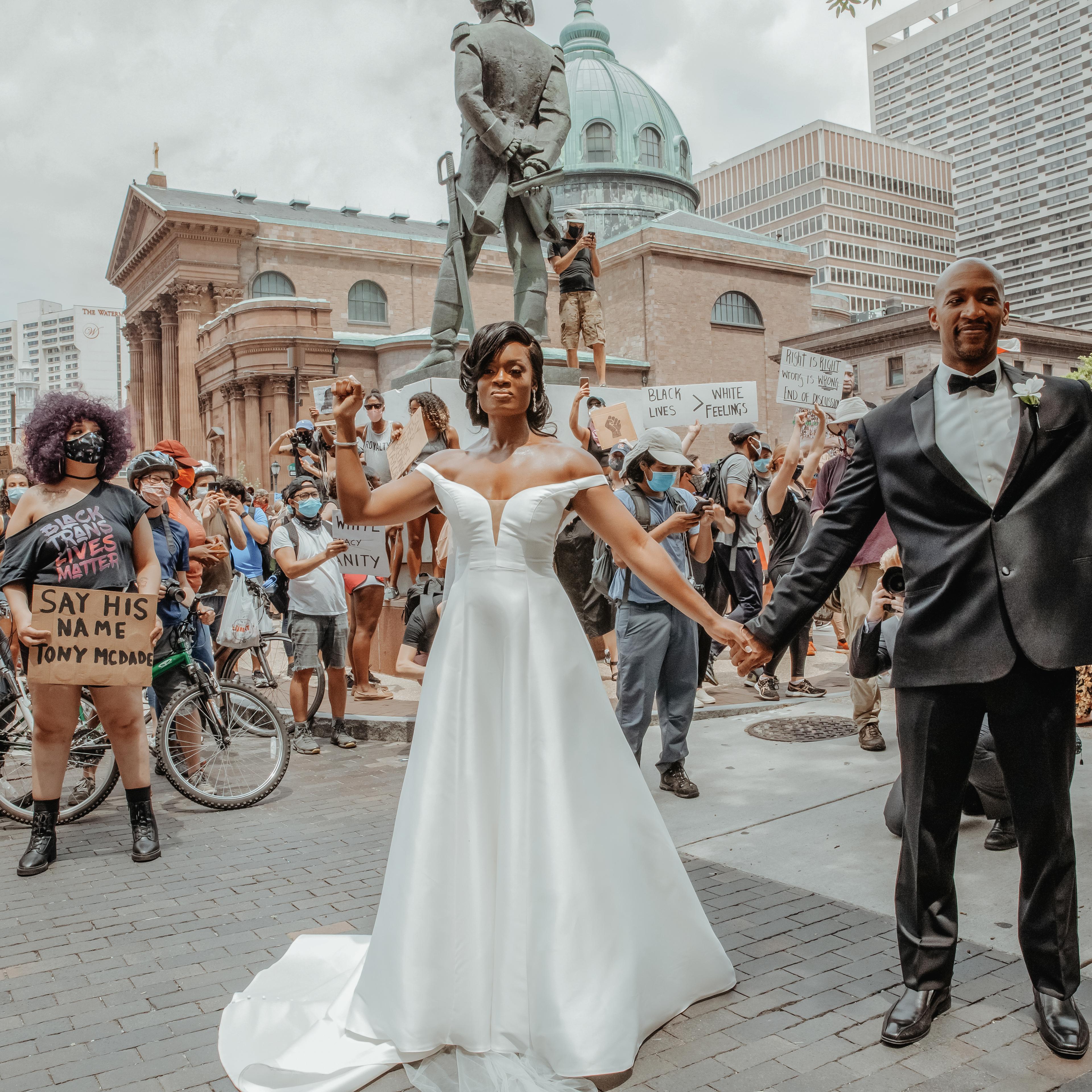Kerry Anne and Michael Gordon join a Black Lives Matter protest taking place alongside their wedding ceremony at The Logan hotel in Philadelphia on June 6, 2020.