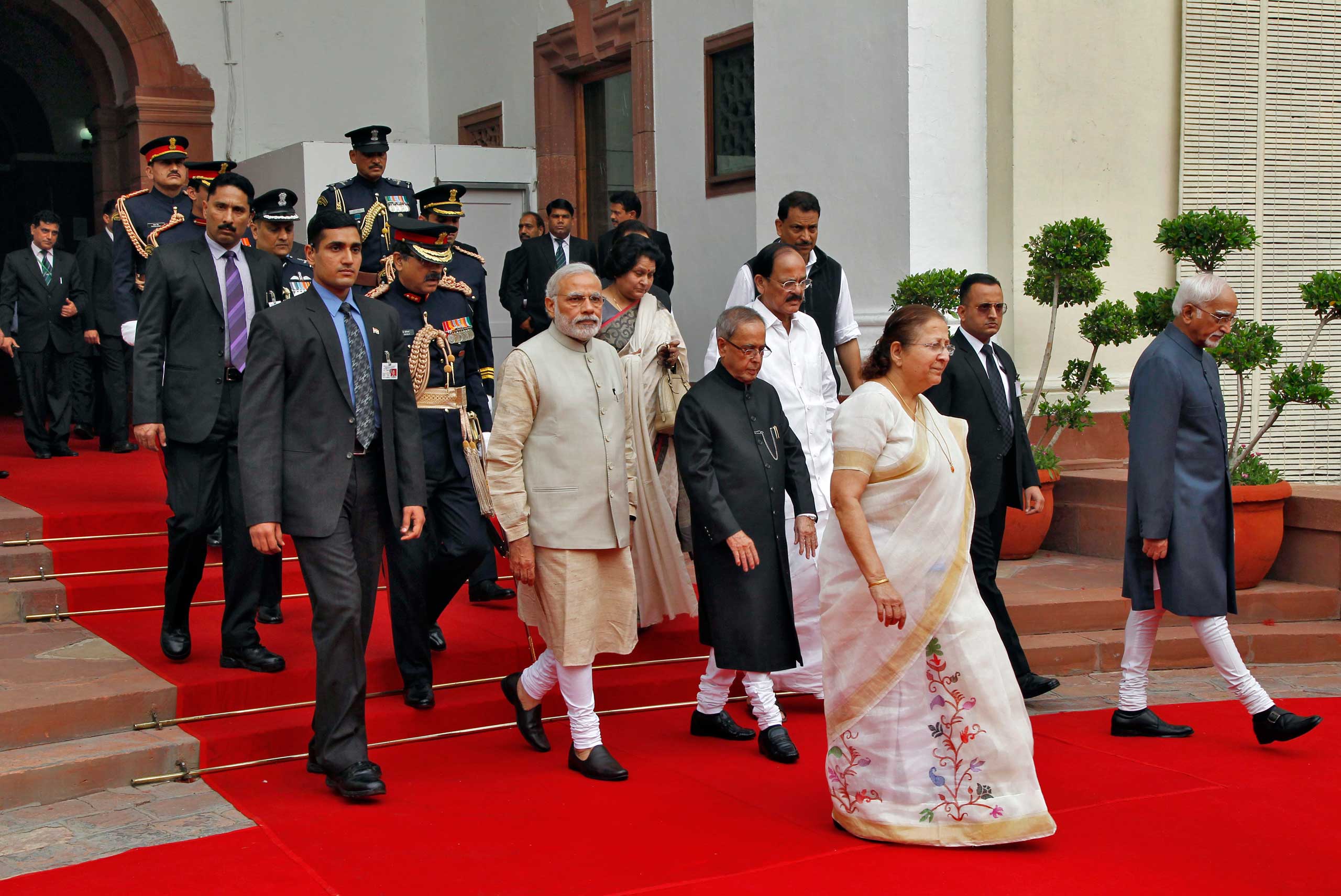 India's PM Modi, President Mukherjee, Lok Sabha speaker Mahajanand Vice President Ansari walk inside the parliament premises as they arrive to attend the first day of the budget session in New Delhi