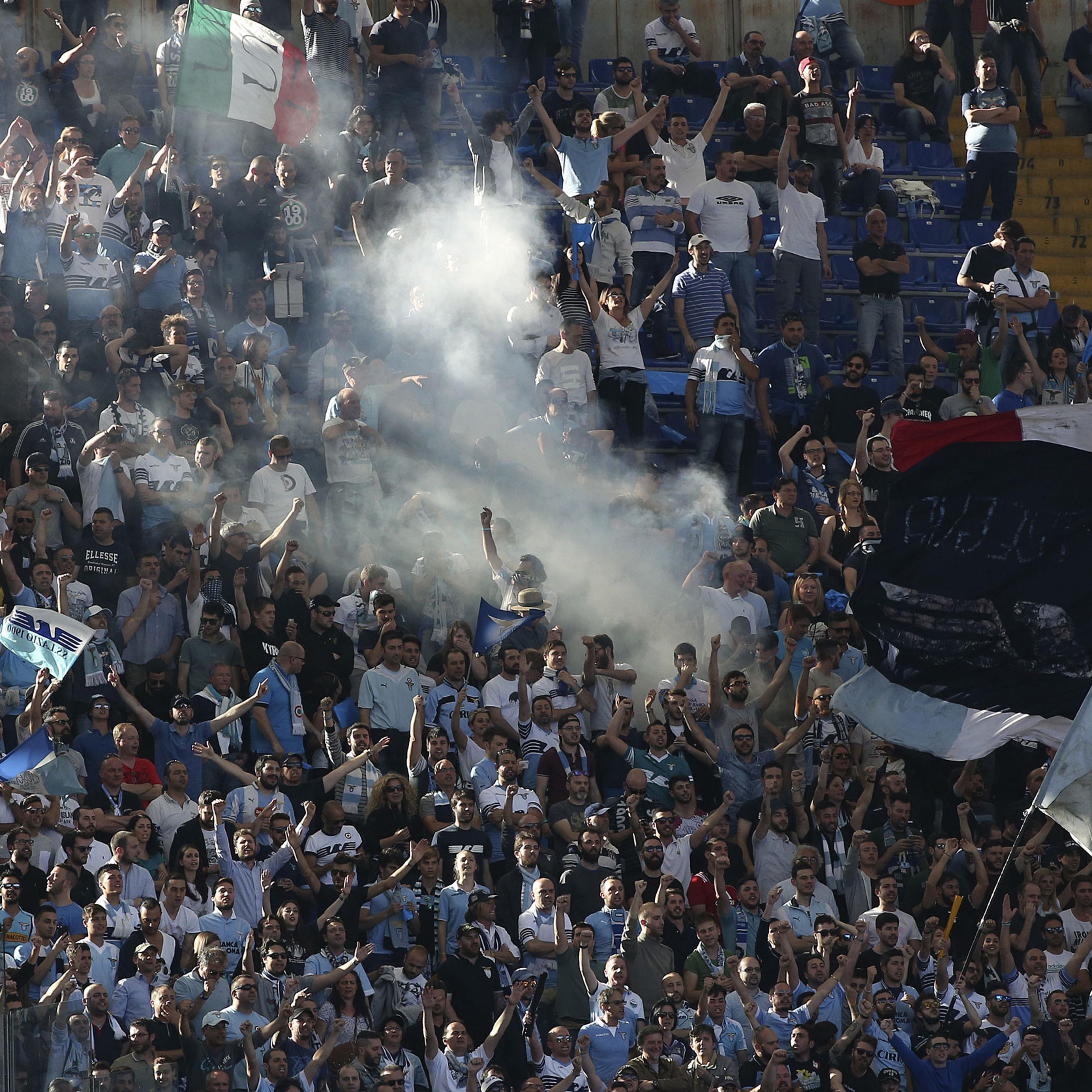 Lazio's supporters shout slogans before their Serie A soccer match against AS Roma at the Olympic stadium in Rome