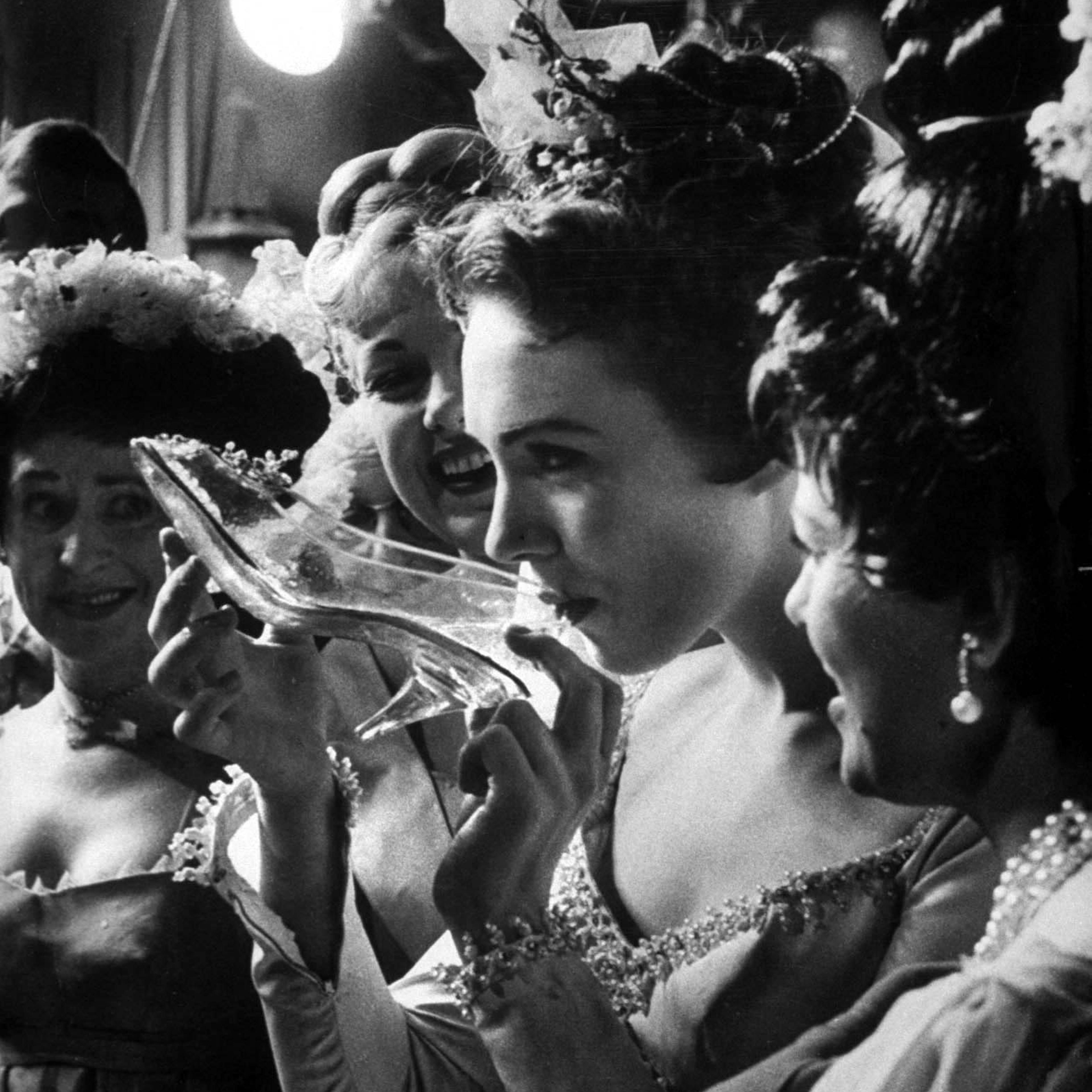 Julie Andrews taking a sip from the glass slipper during the TV production of "Cinderella".