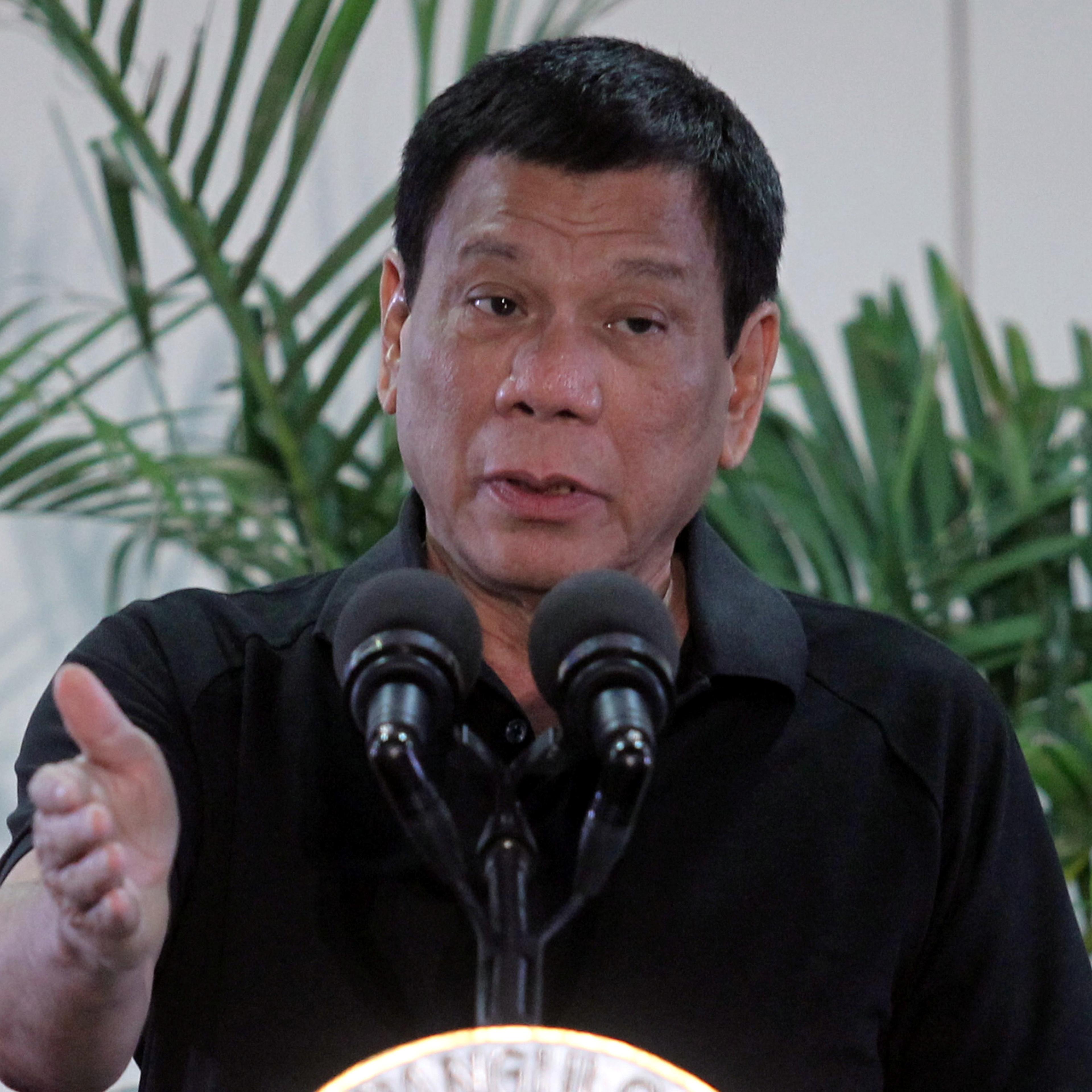 Philippines President Rodrigo Duterte gestures during a news conference upon his arrival from Vietnam trip at the International Airport in Davao city